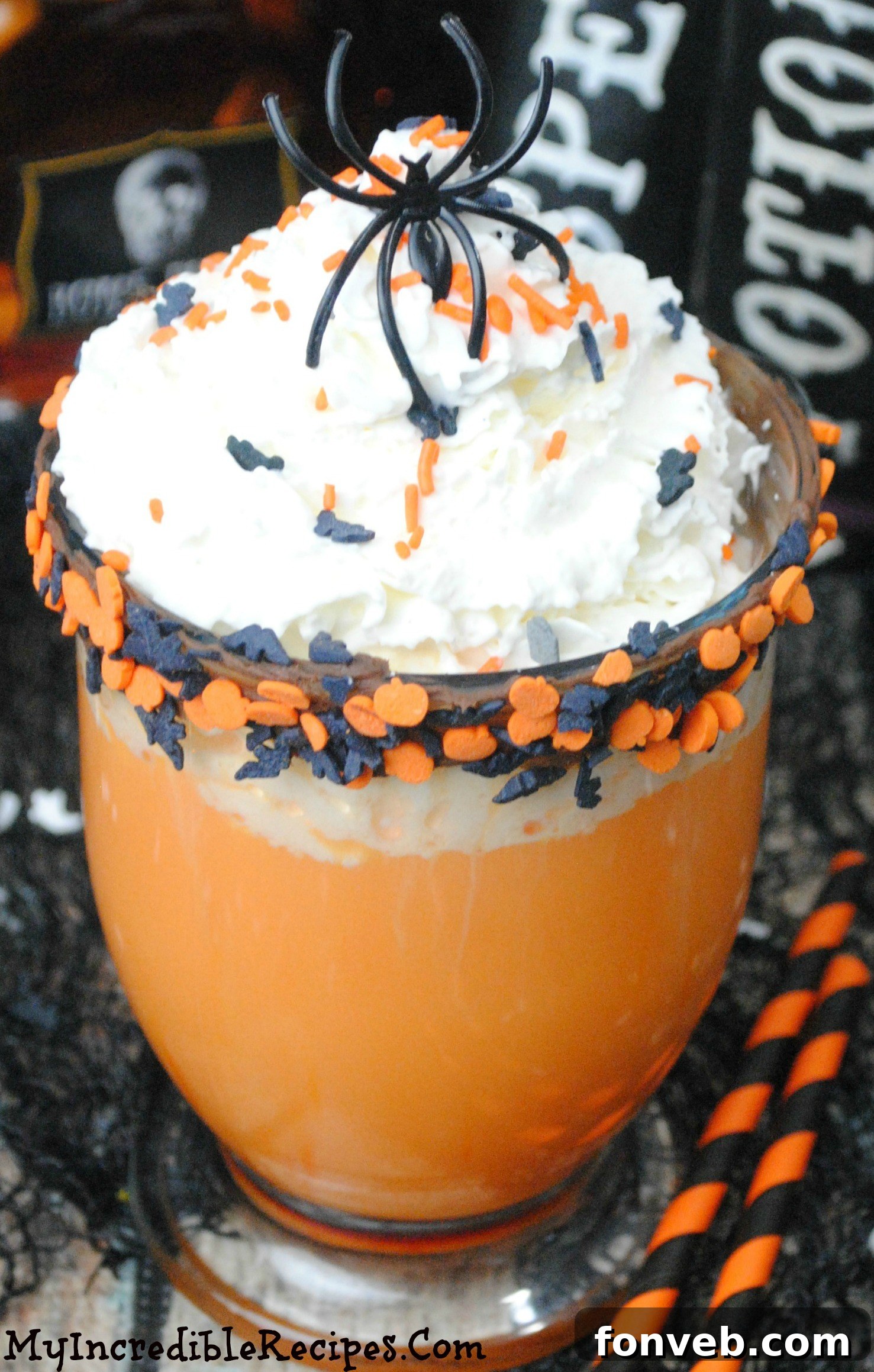 Rich Slow Cooker Halloween Hot Chocolate in a festive mug with whipped cream and sprinkles