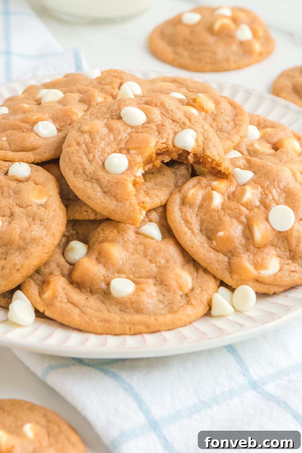 autumn cookies on a platter on table with cookies around it