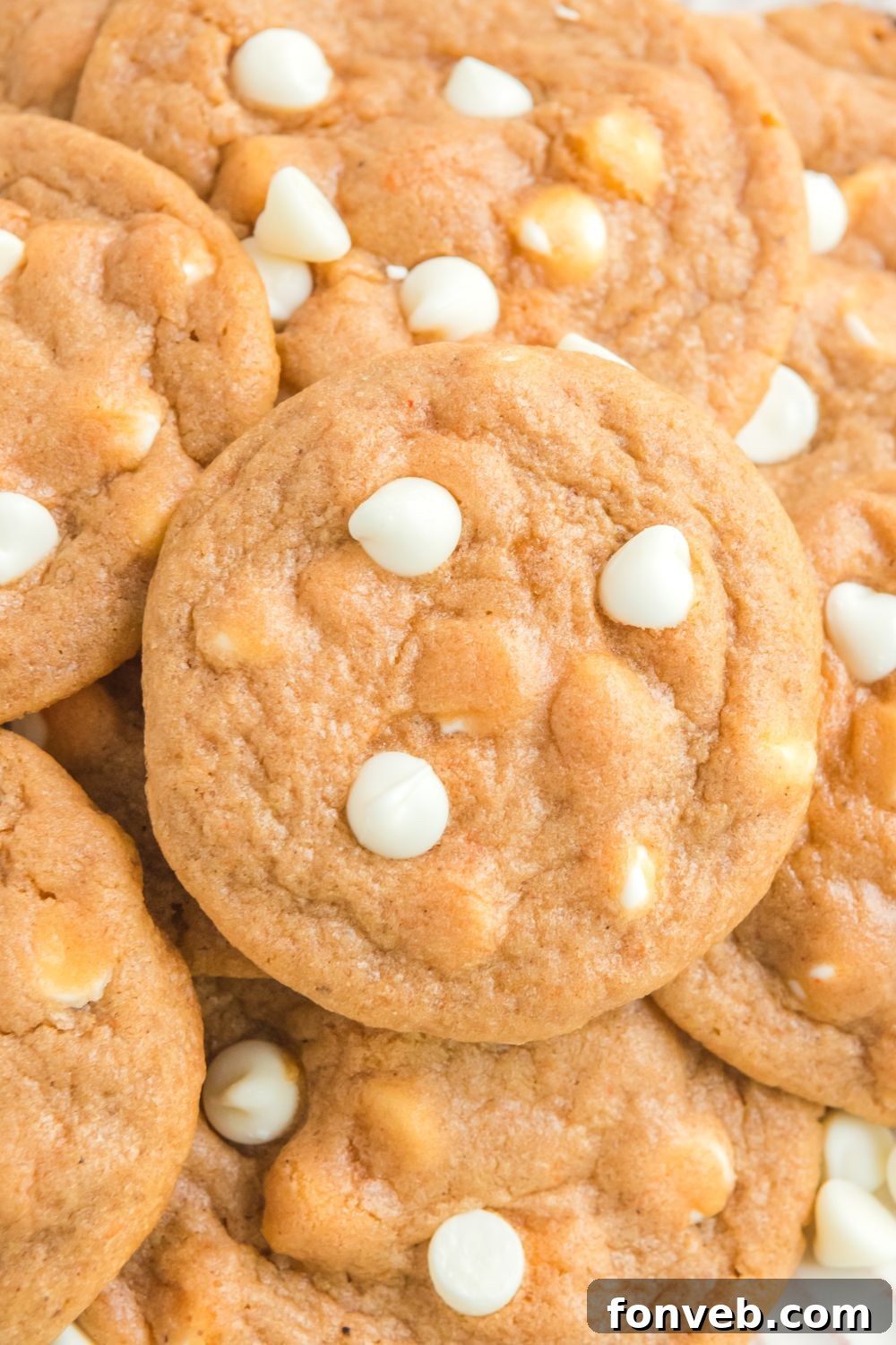 pumpkin spice cookies stacked on top of each other on a plate