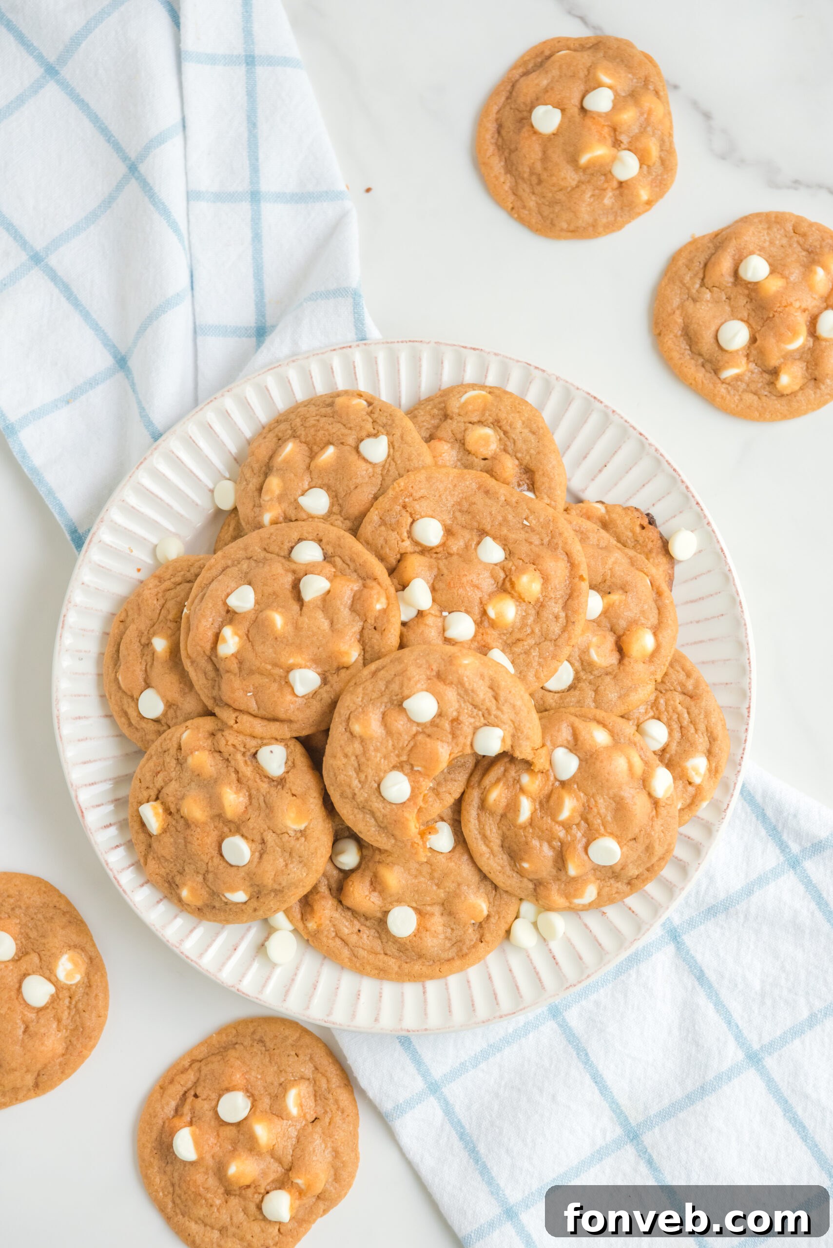overhead shot of a pile of Pumpkin Spice Pudding Cookies on a white plate