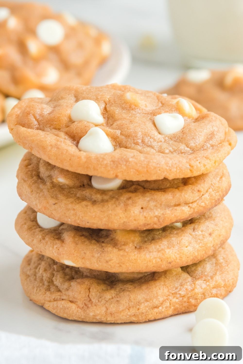 stacked pumpkin cookies on table