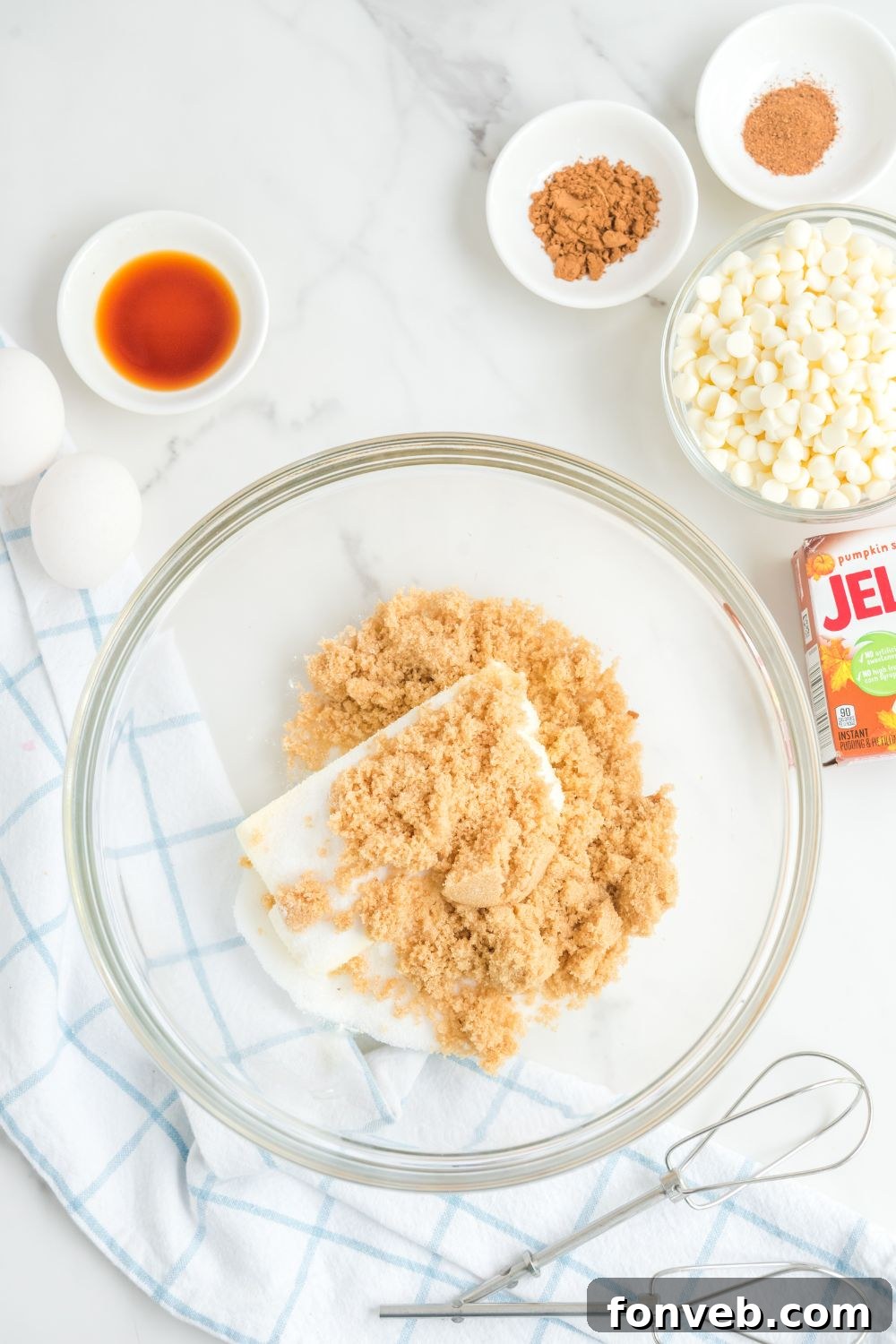 butter and sugar in a glass mixing bowl 
