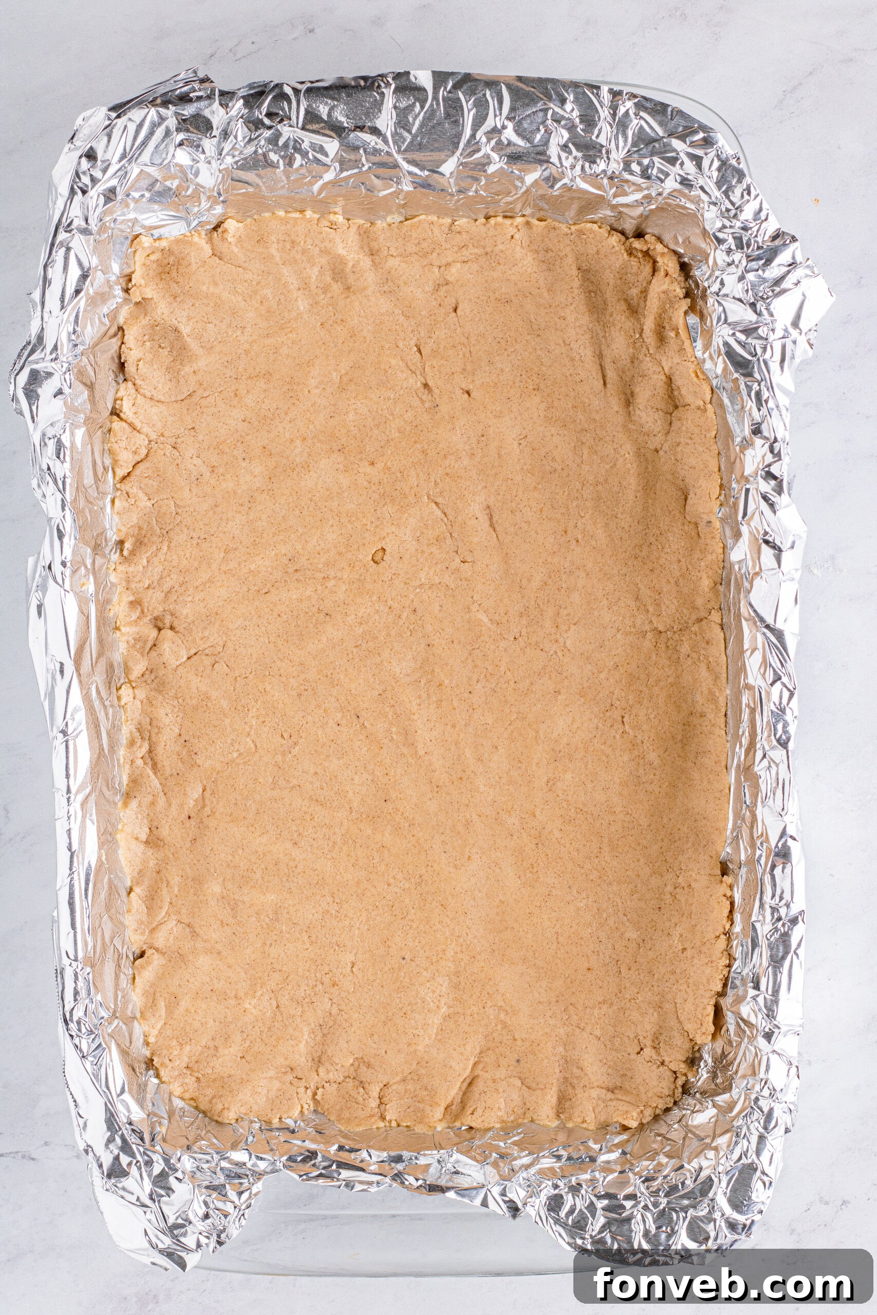 crust for pumpkin bars in table with foil