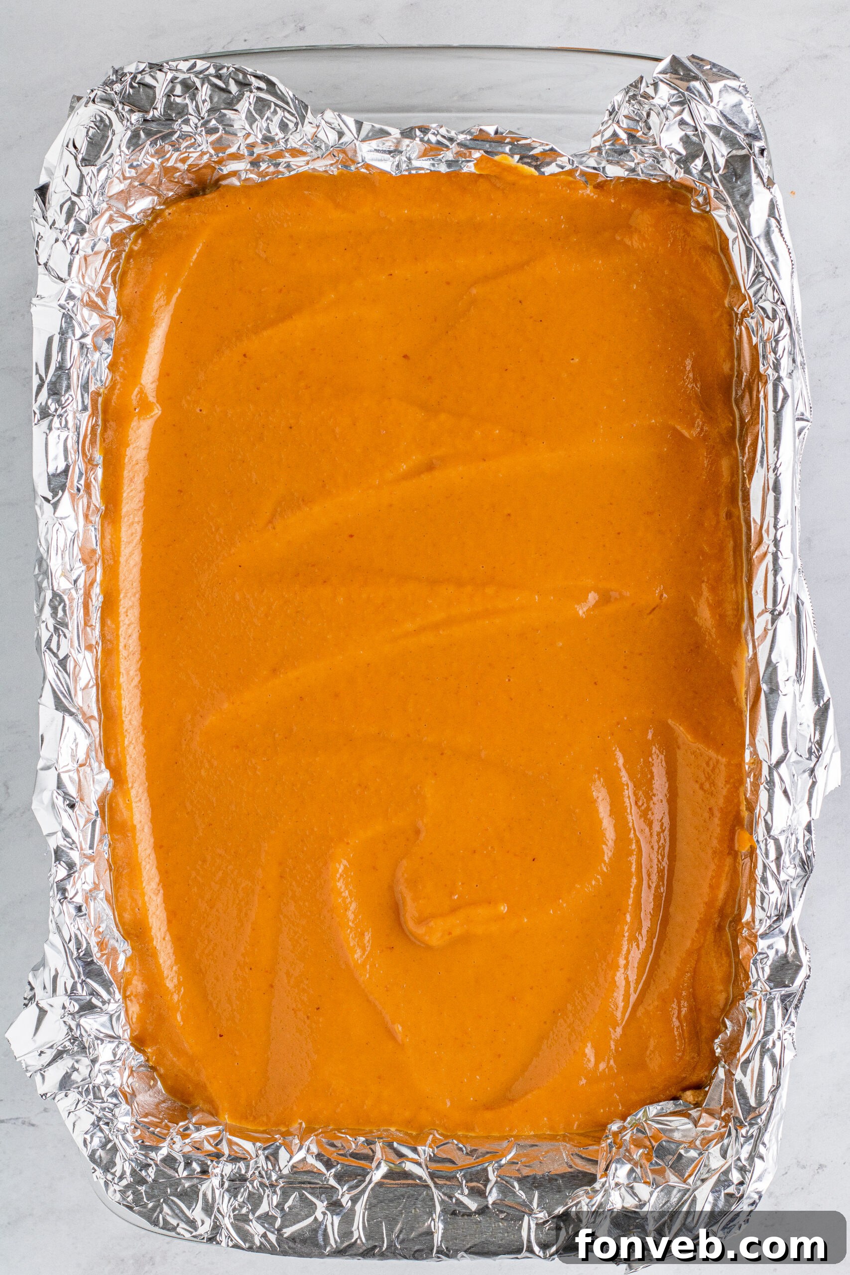 pumpkin batter spread in pan