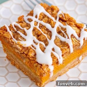 Pumpkin Streusel Bar sliced on a white plate
