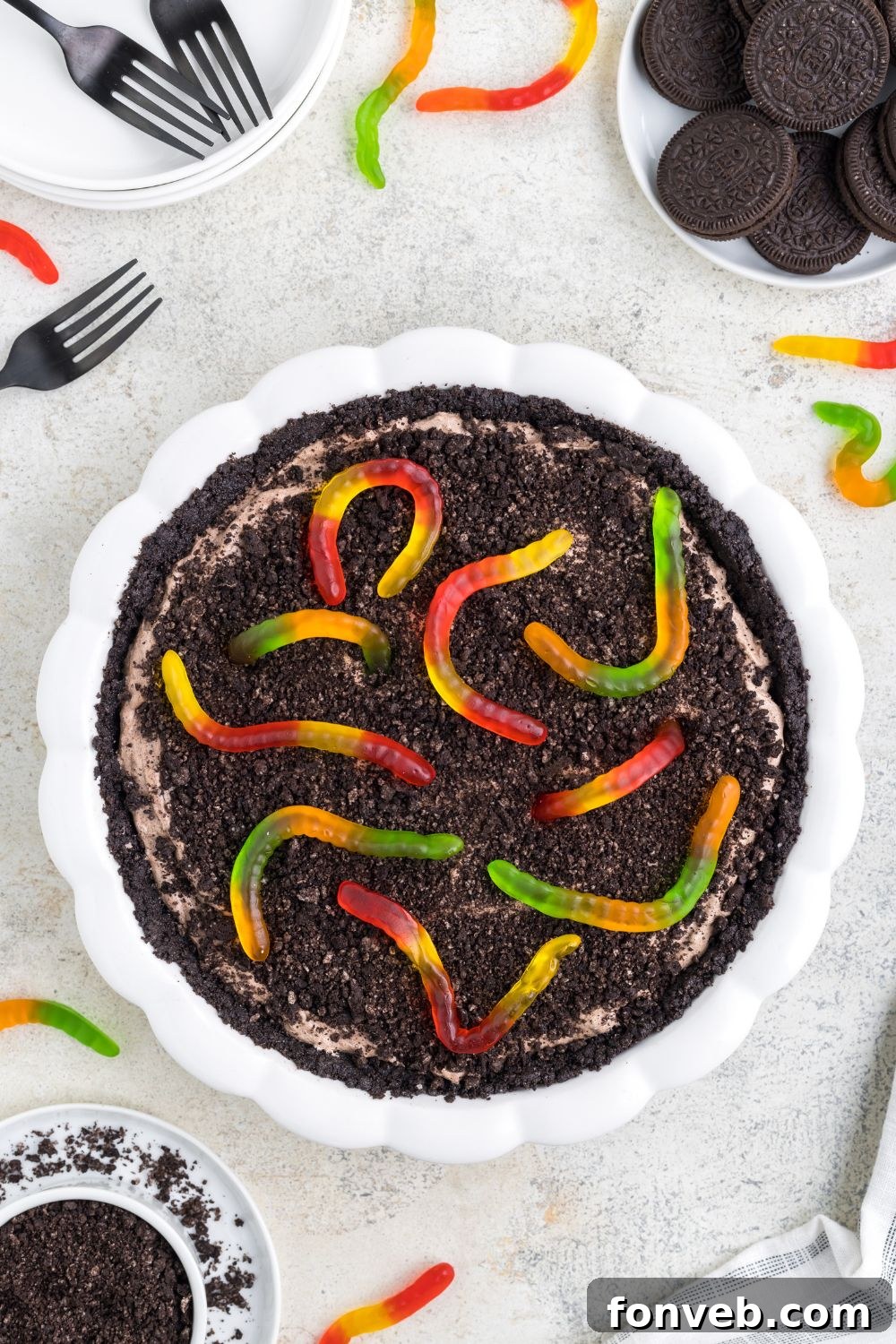 gummy worm topped dirt pie on table