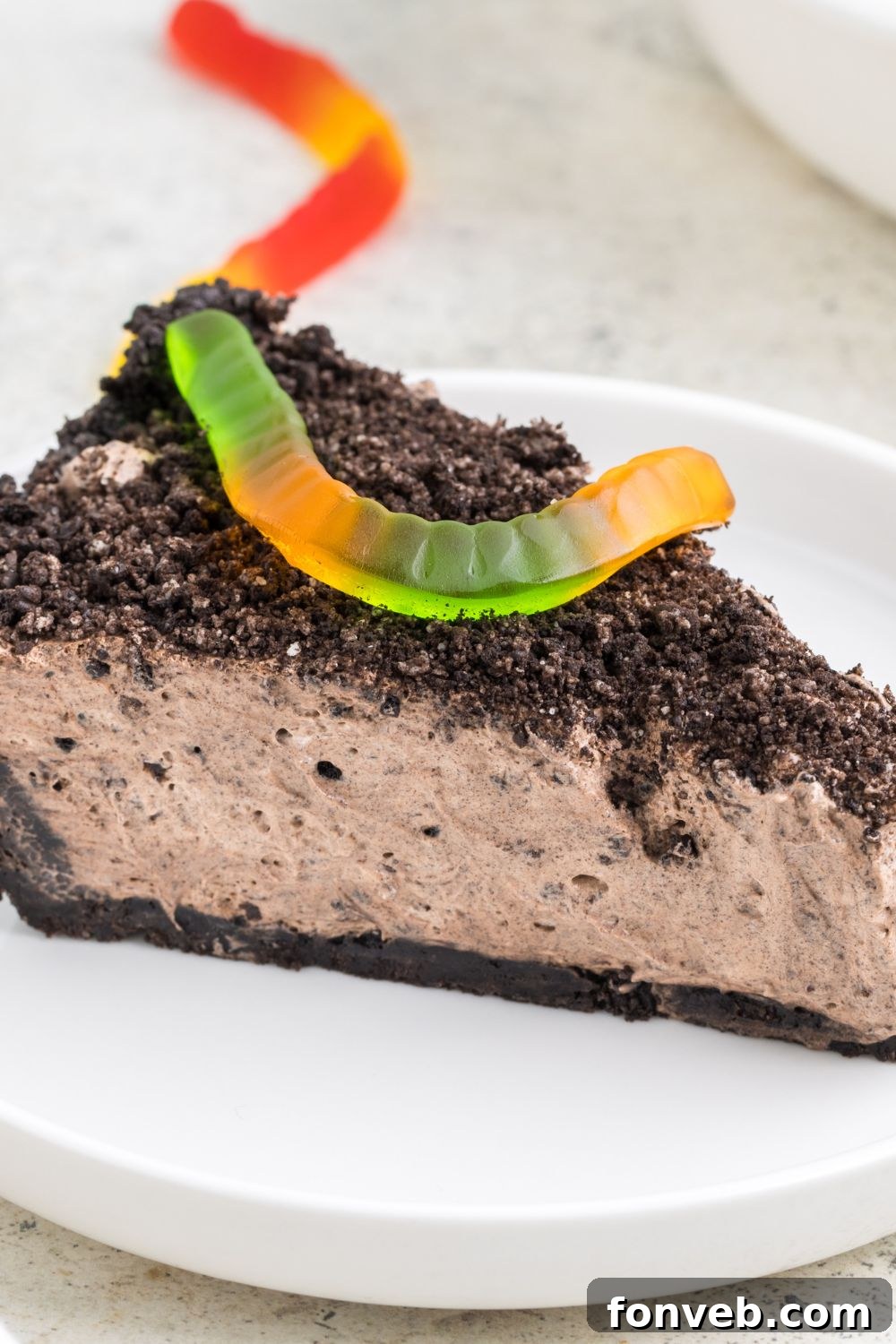dirt pie on plate with a gummy worm on top