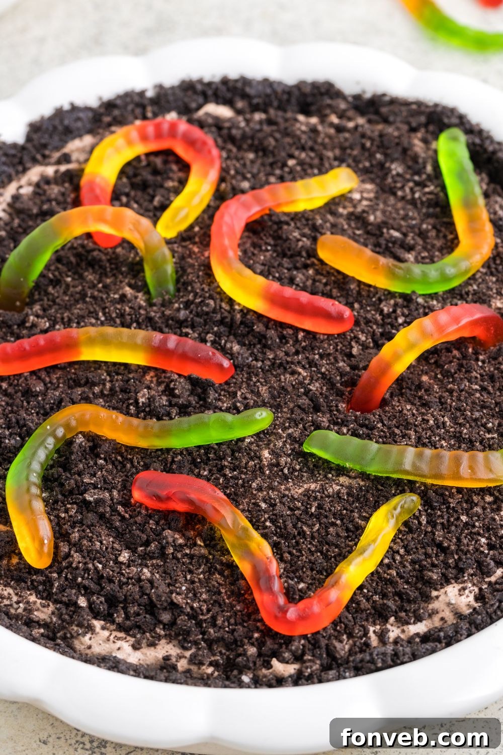 overhead shot of mud pie with gummy worms on top