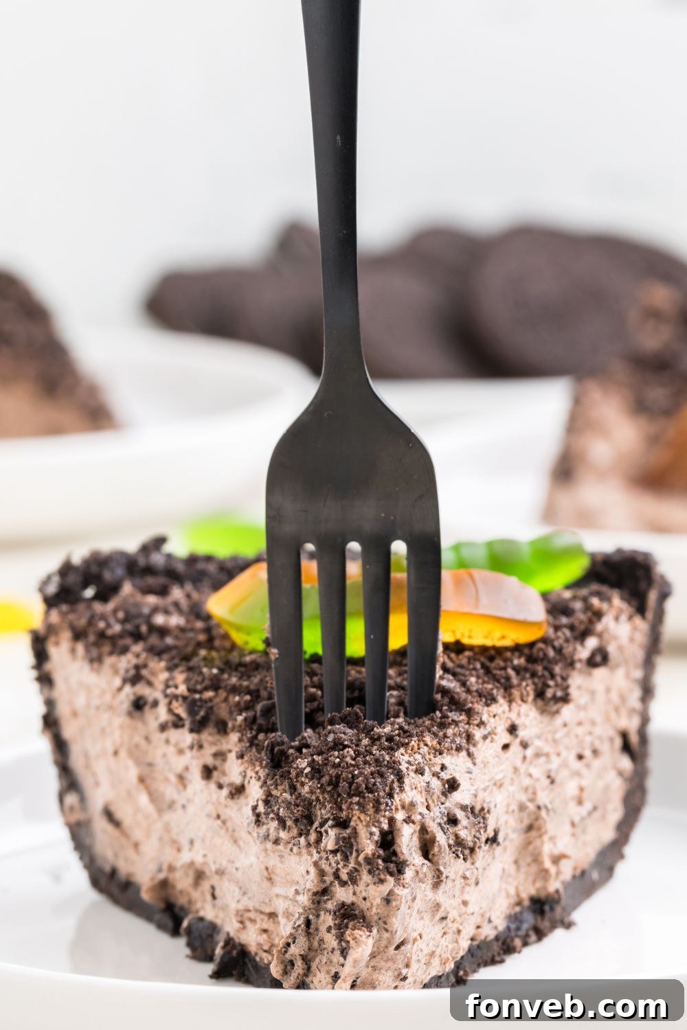 oreo dirt pie sliced on a plate