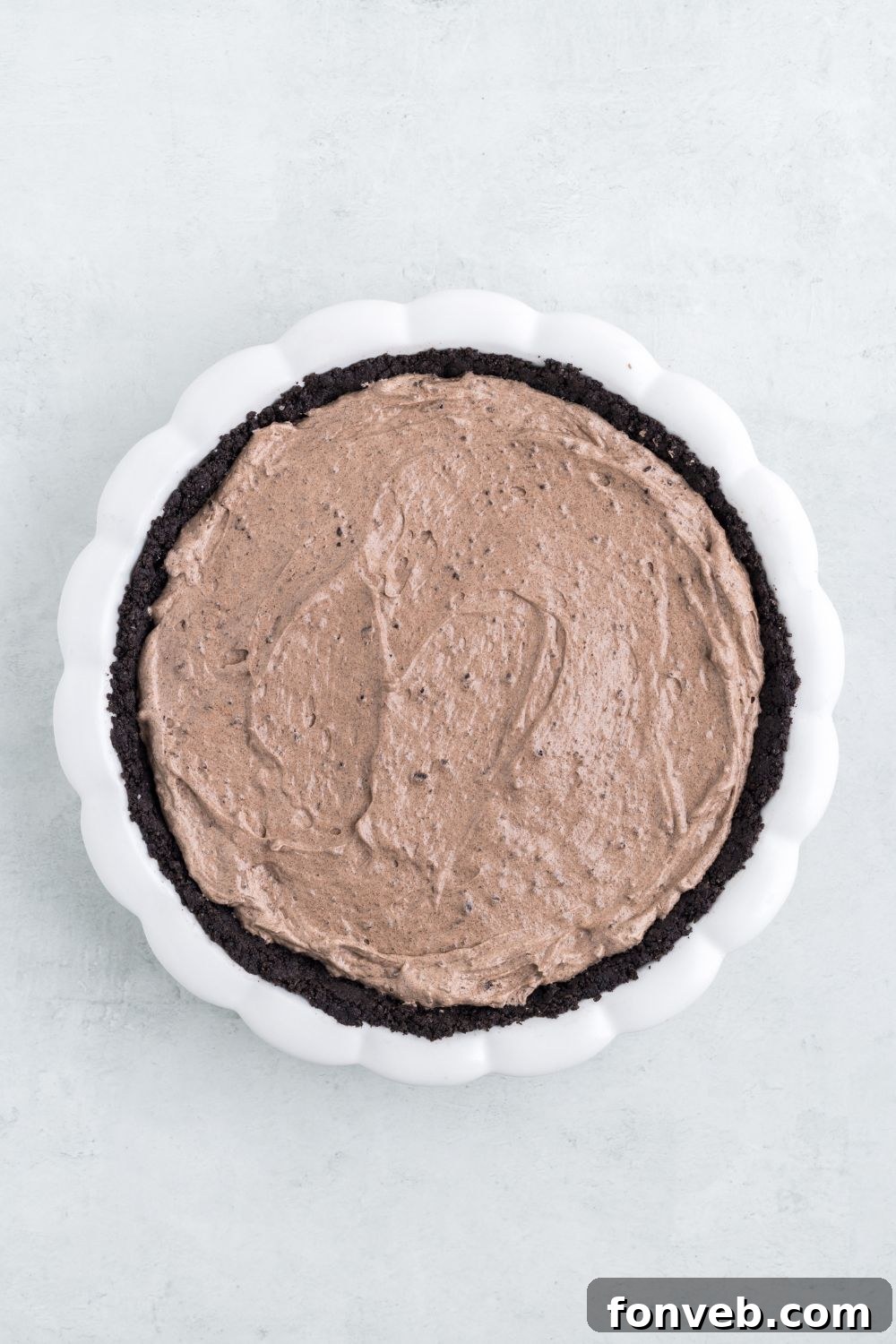 chocolate pudding pie in pan on table