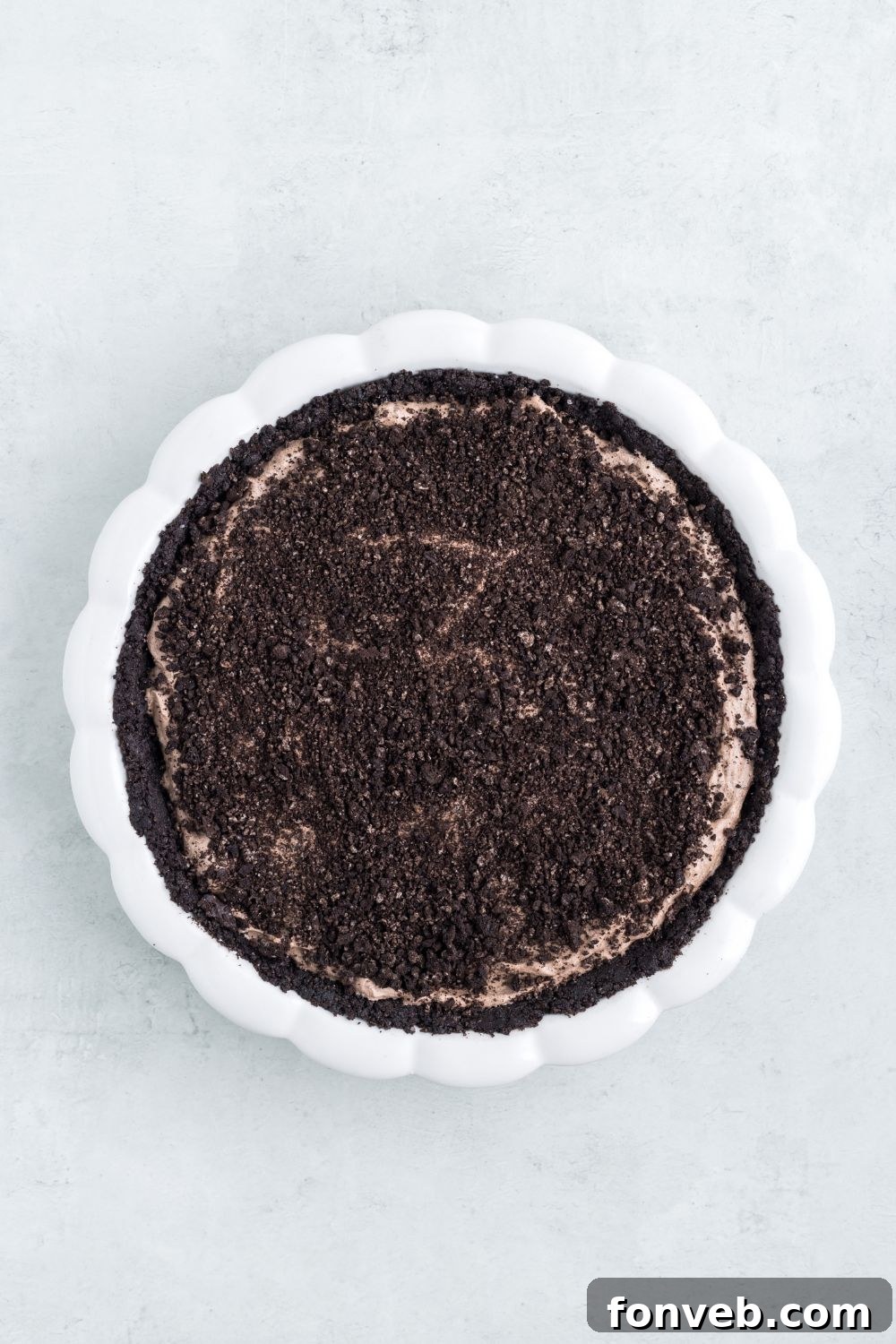 Oreo crumbles on top of the pie