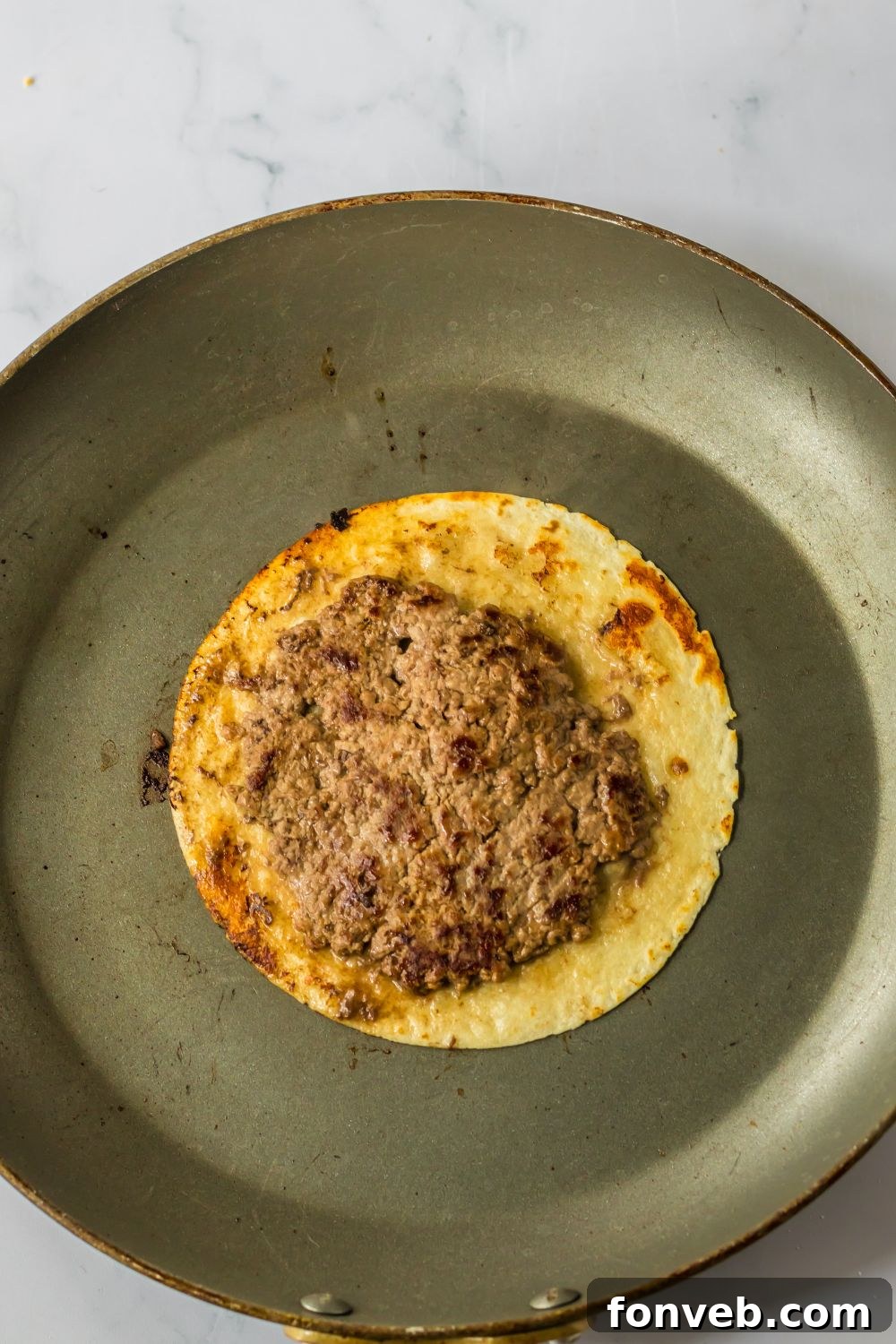 Smashed Big Mac Tacos 7 Crispy tortilla with a perfectly cooked burger patty on top, fresh from the skillet