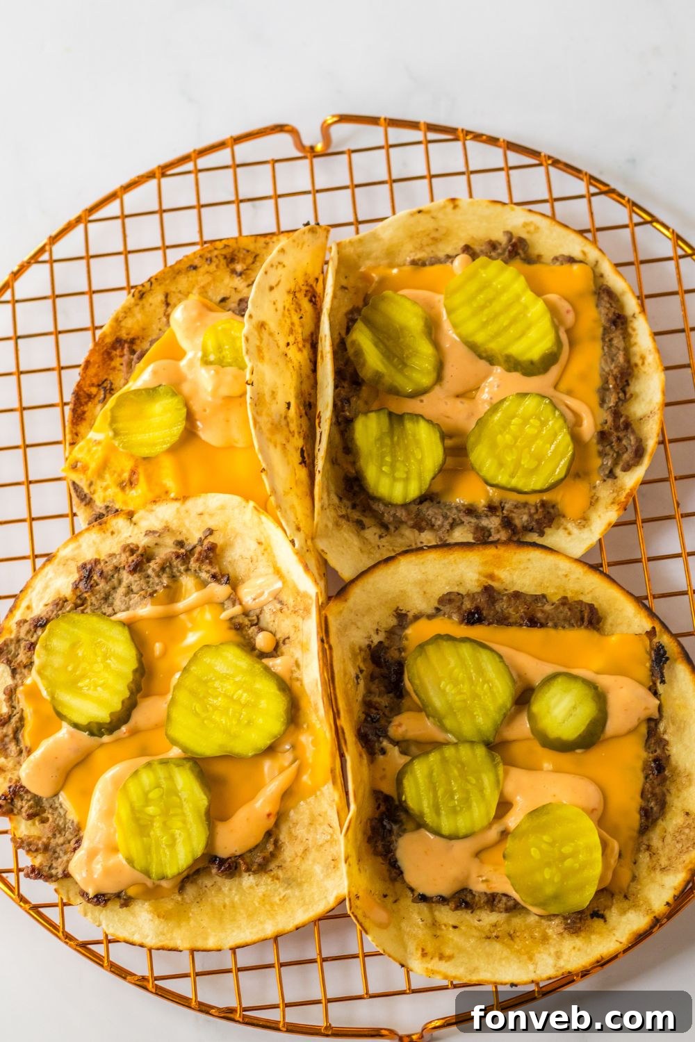 Smashed Big Mac Tacos 9 Smash tacos topped with melted cheese and zesty pickle slices