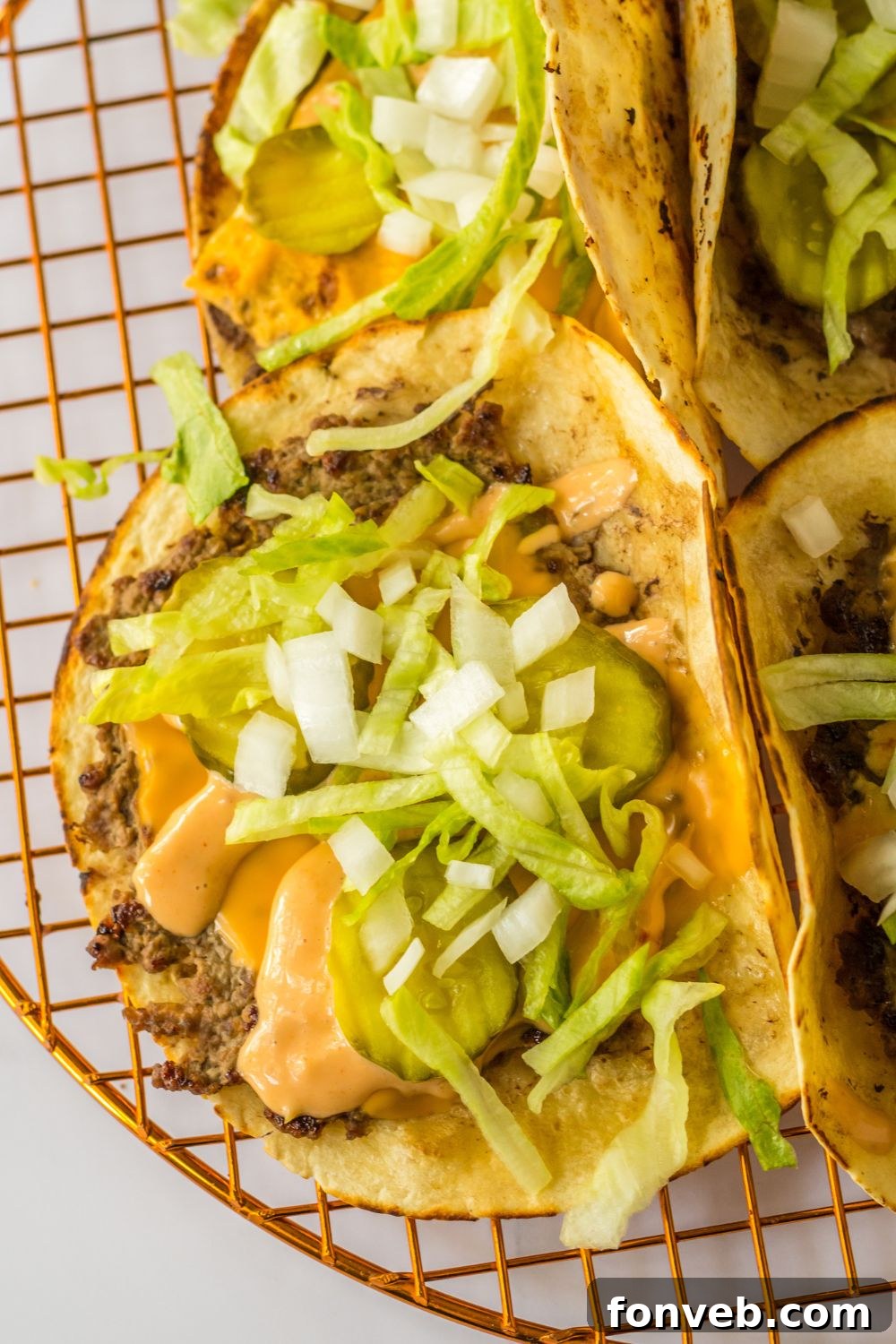 Smashed Big Mac Tacos 10 Overhead shot of multiple Big Mac style tacos, beautifully assembled and vibrant