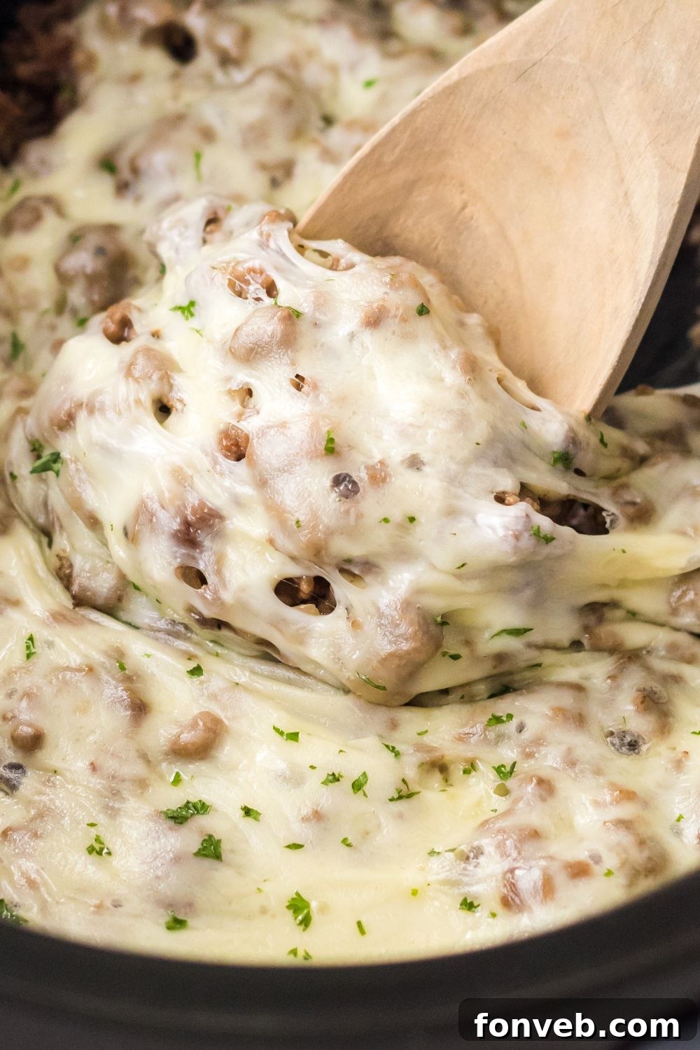 ground beef mixture with cheese in slow cooker