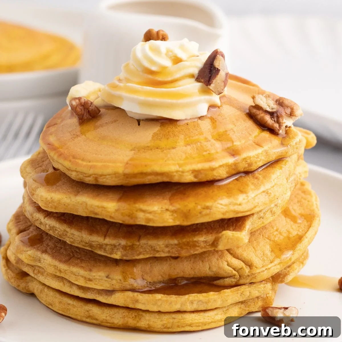 Pumpkin Spice Pancakes stacked on a plate