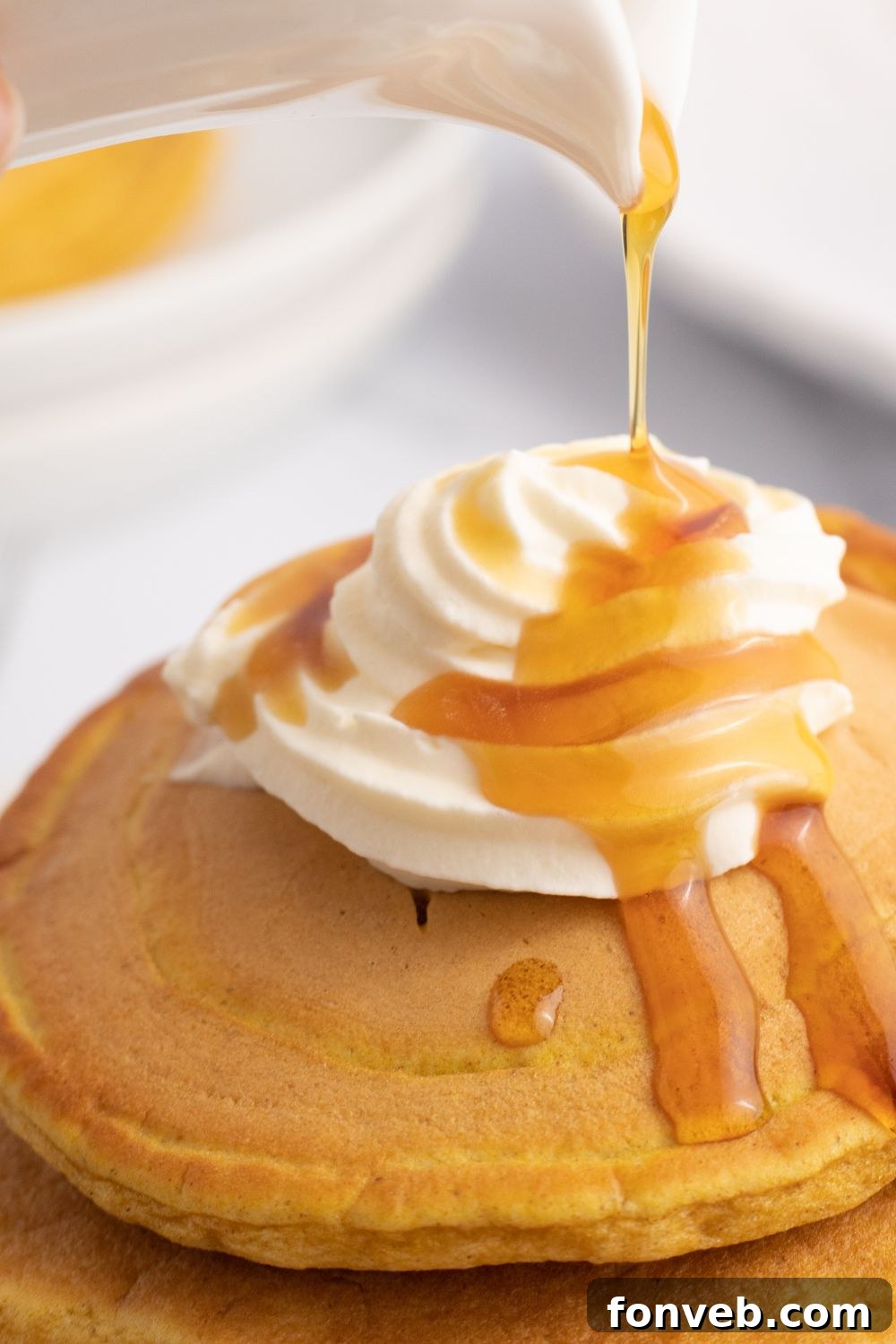 syrup drizzled on pancakes