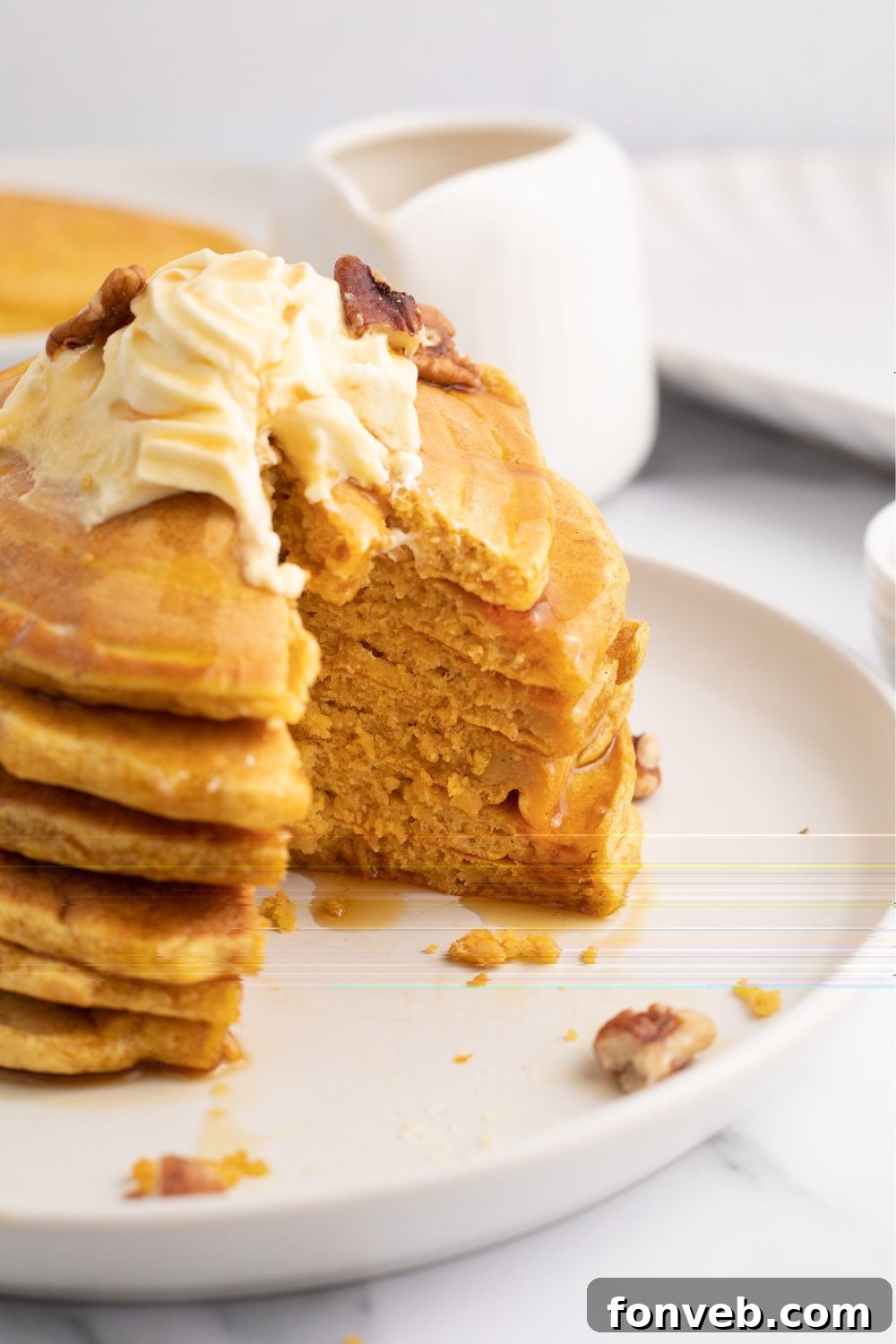 pumpkin pancakes stacked on plate