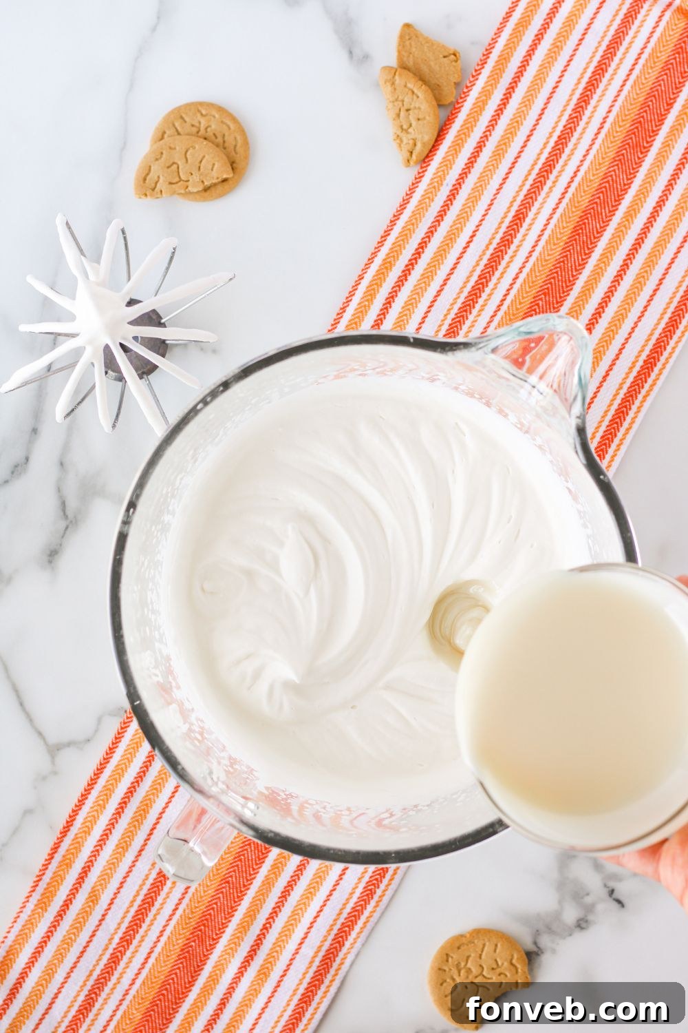 Spiced Pumpkin Ice Cream Pie 11 whipped cream with condensed milk in a bowl