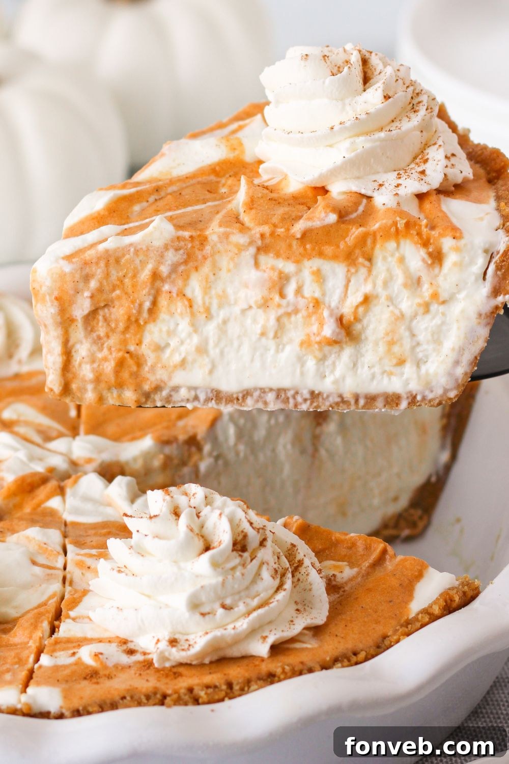 Spiced Pumpkin Ice Cream Pie 16 pumpkin cream cheese pie with a slice lifting out of it