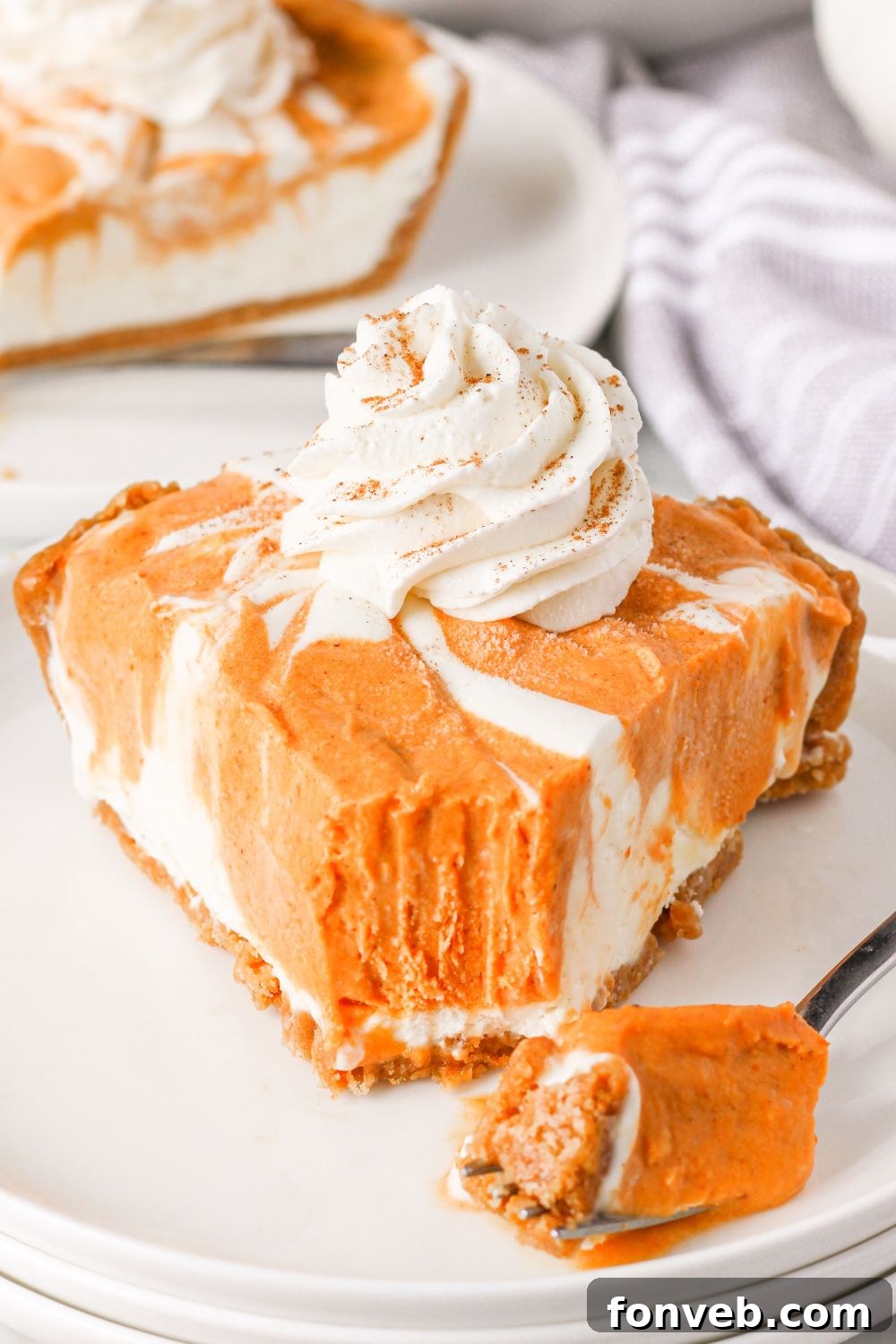 Spiced Pumpkin Ice Cream Pie 19 no churn pumpkin pie ice cream with pie slice on plate