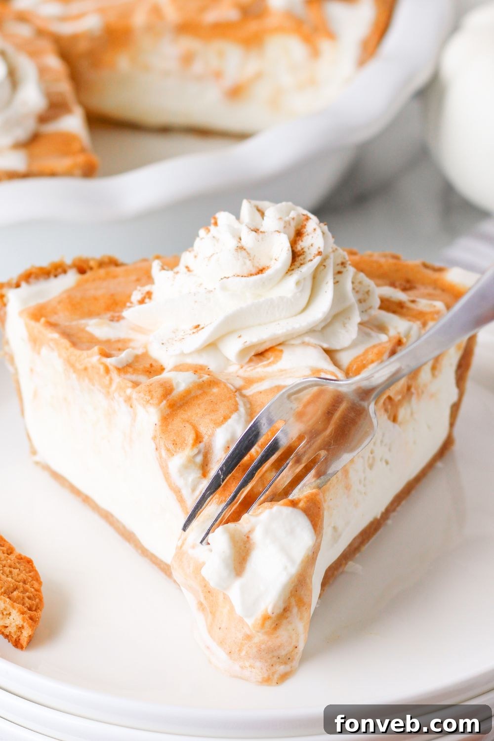 Spiced Pumpkin Ice Cream Pie 21 fork slicing into a piece of pie