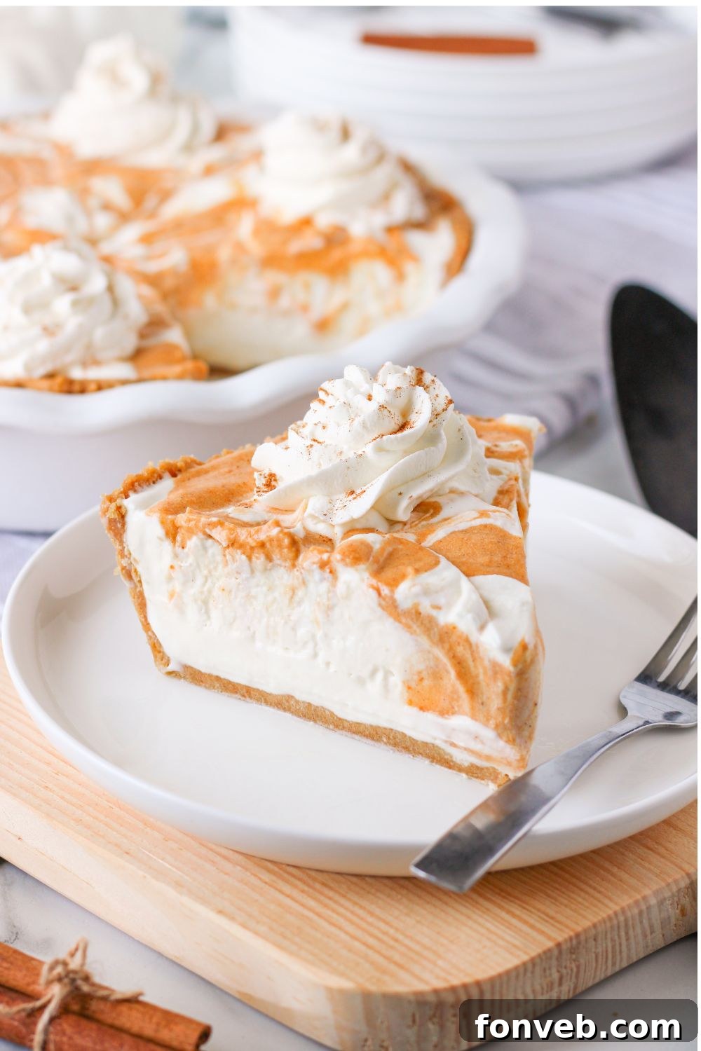 Spiced Pumpkin Ice Cream Pie 22 pumpkin pie ice cream on a plate with fork on side