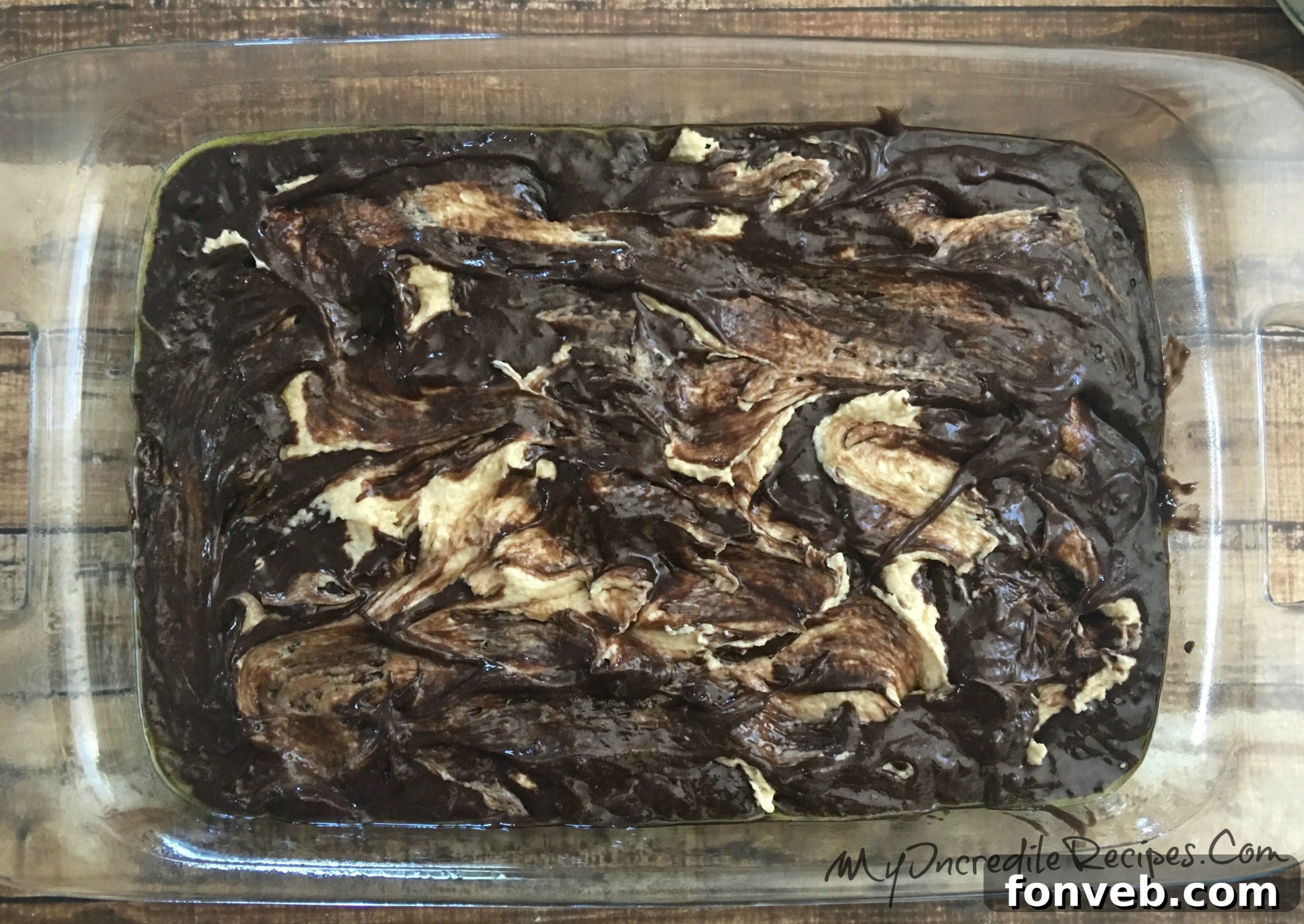 Another close-up of the cake, highlighting the melted chocolate chips and Reese's cups within the creamy swirls