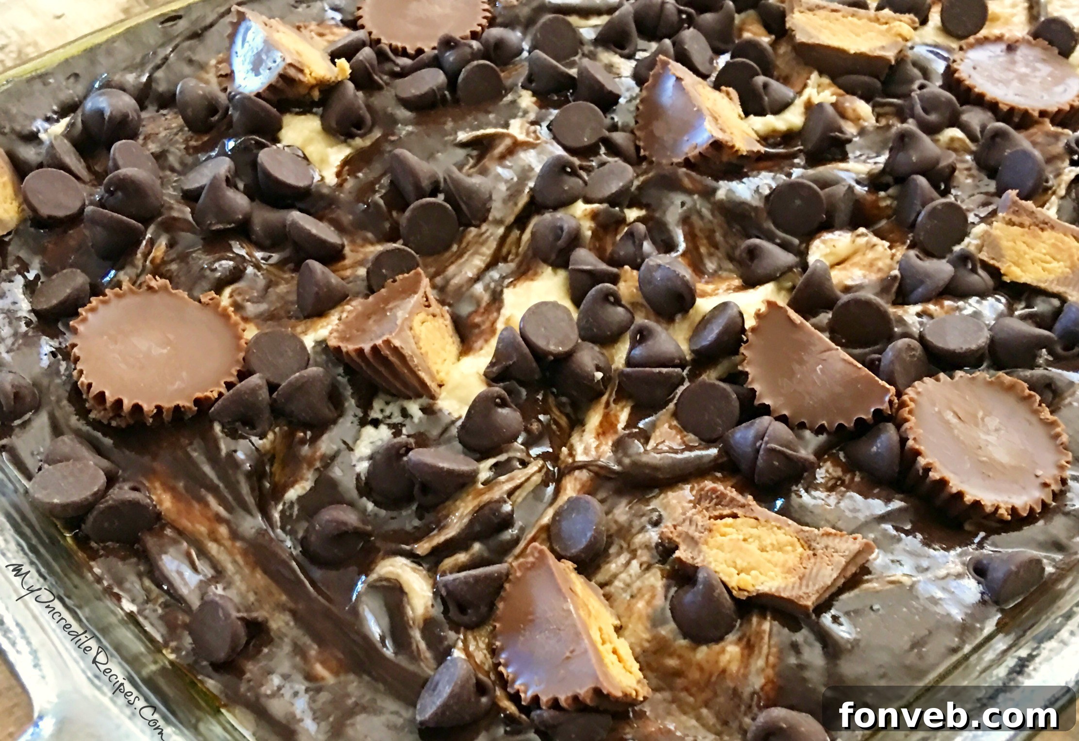 Top-down view of the entire Peanut Butter Earthquake Cake in a baking dish, showcasing the cracks and swirls on its surface