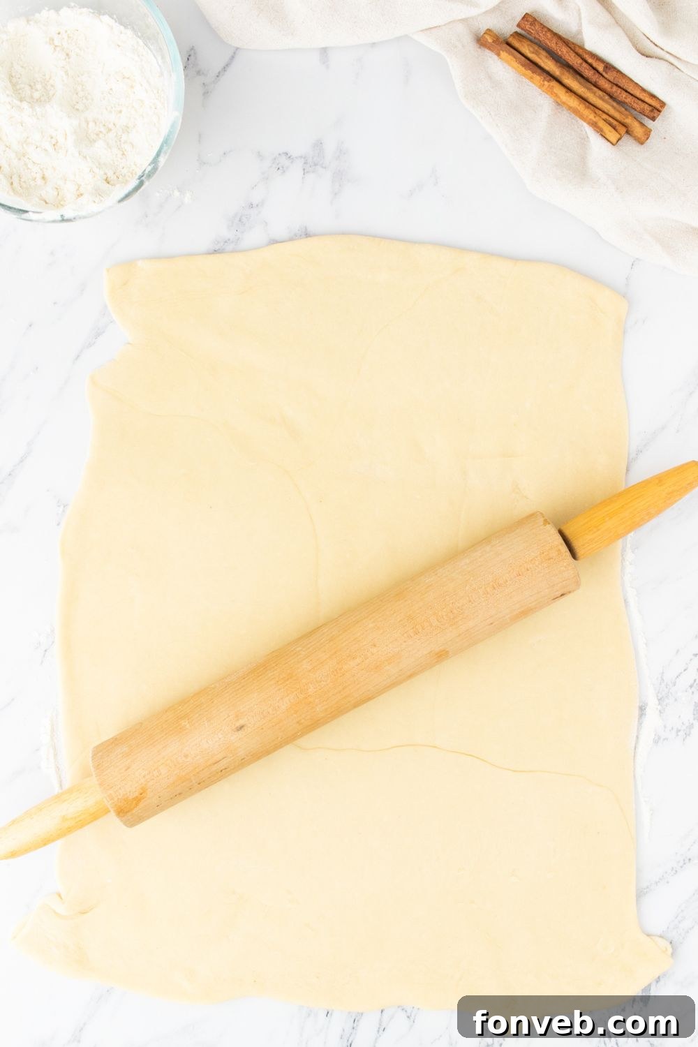 rolling out dough with a rolling pin