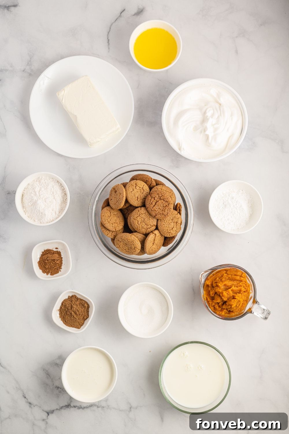 Various ingredients for Pumpkin Delight displayed in clear glass containers on a wooden table, ready for preparation.