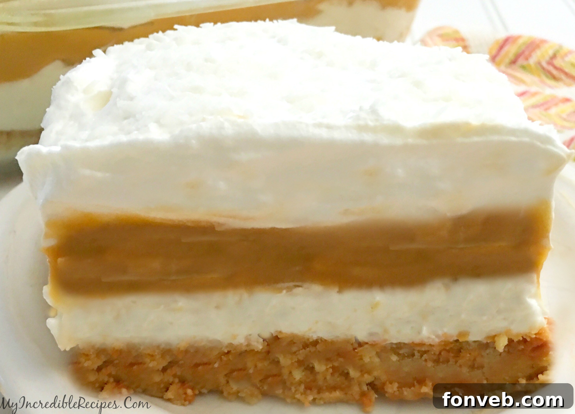Spiced Pumpkin Cheesecake Lasagna 2 Delicious Pumpkin Cheesecake Lasagna slice with layered crust, cheesecake, and pumpkin pudding