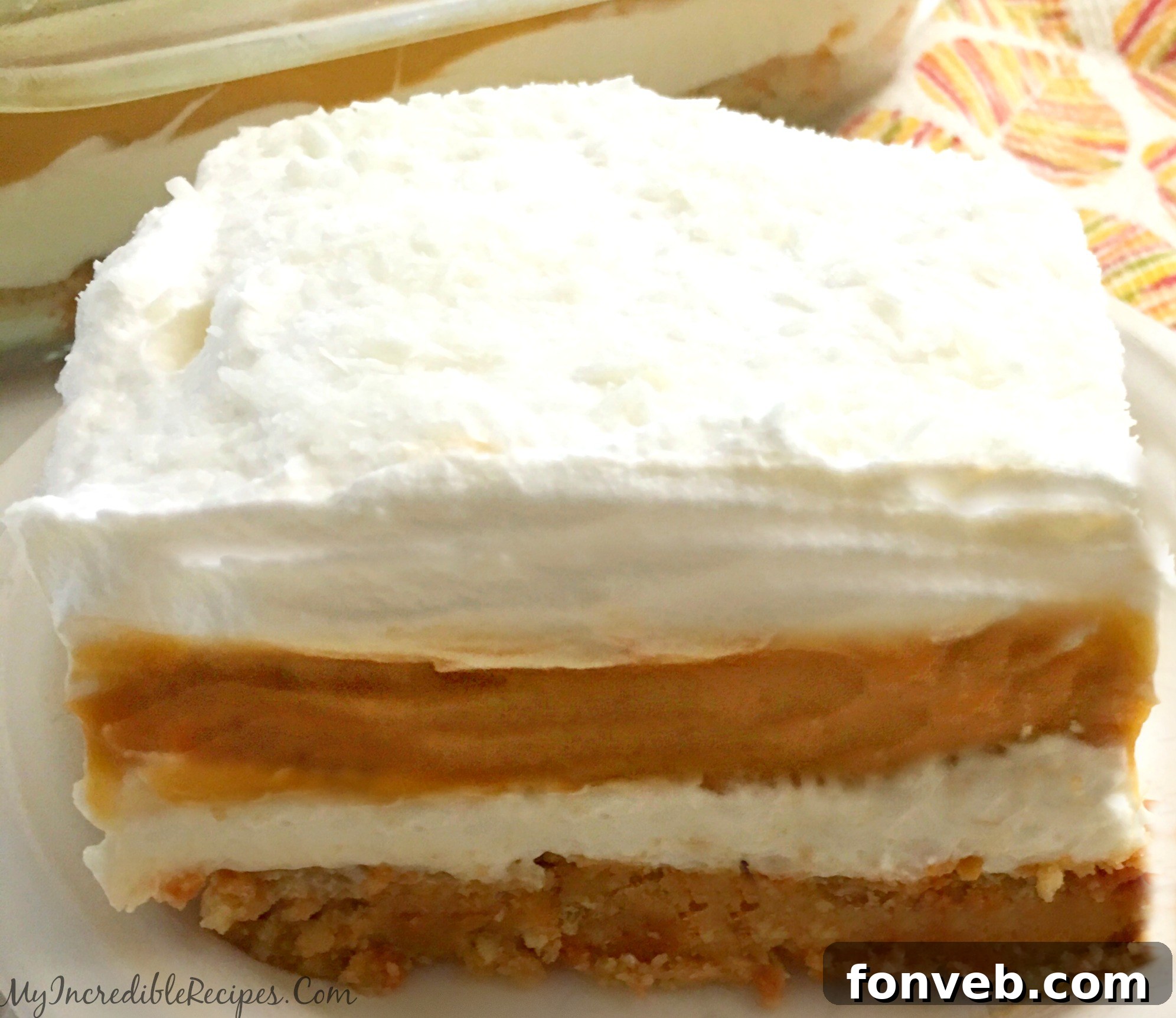 Spiced Pumpkin Cheesecake Lasagna 11 Serving slice of Pumpkin Cheesecake Lasagna on a plate