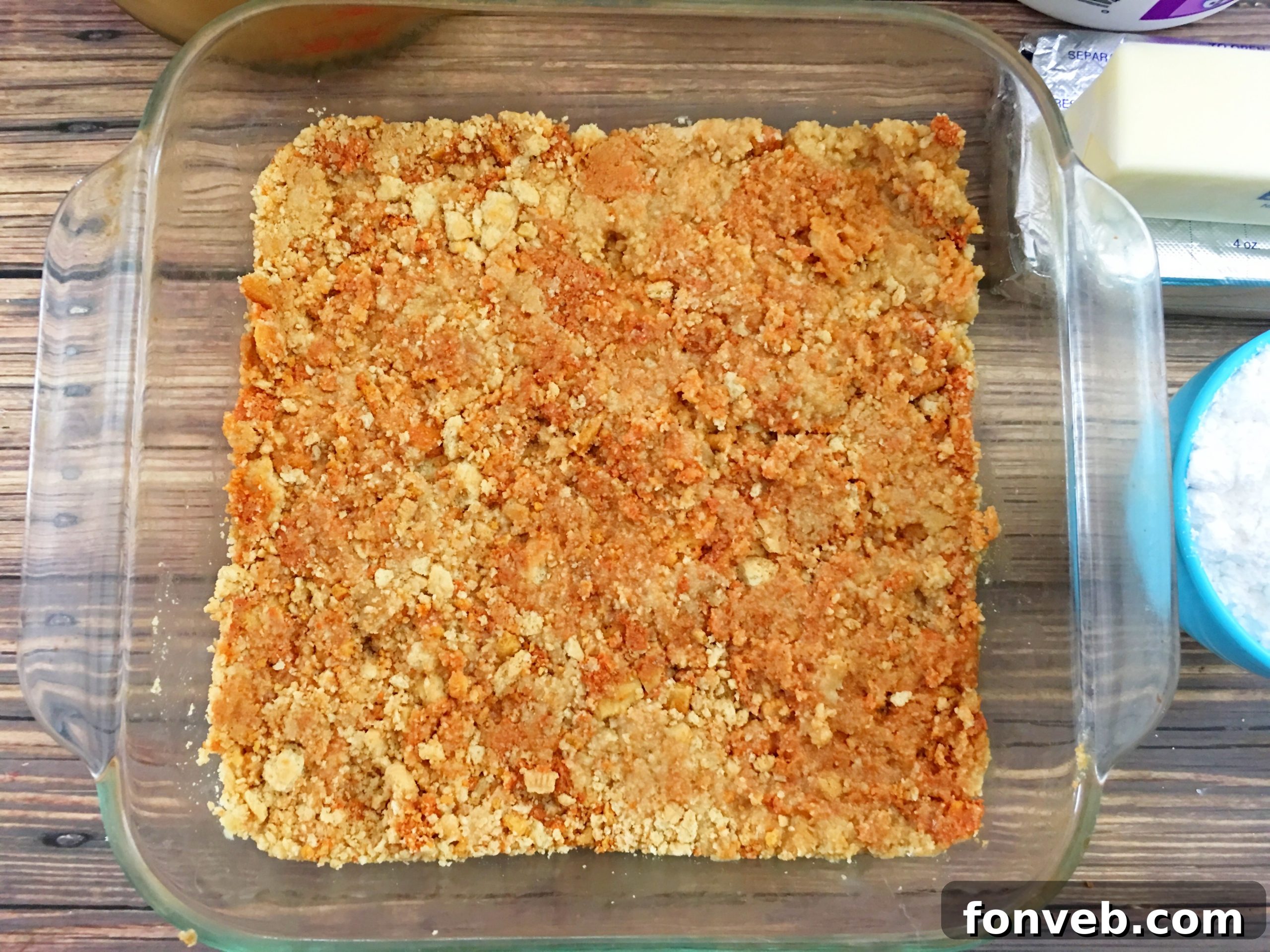 Spiced Pumpkin Cheesecake Lasagna 5 Spreading the creamy cheesecake layer over the Oreo crust