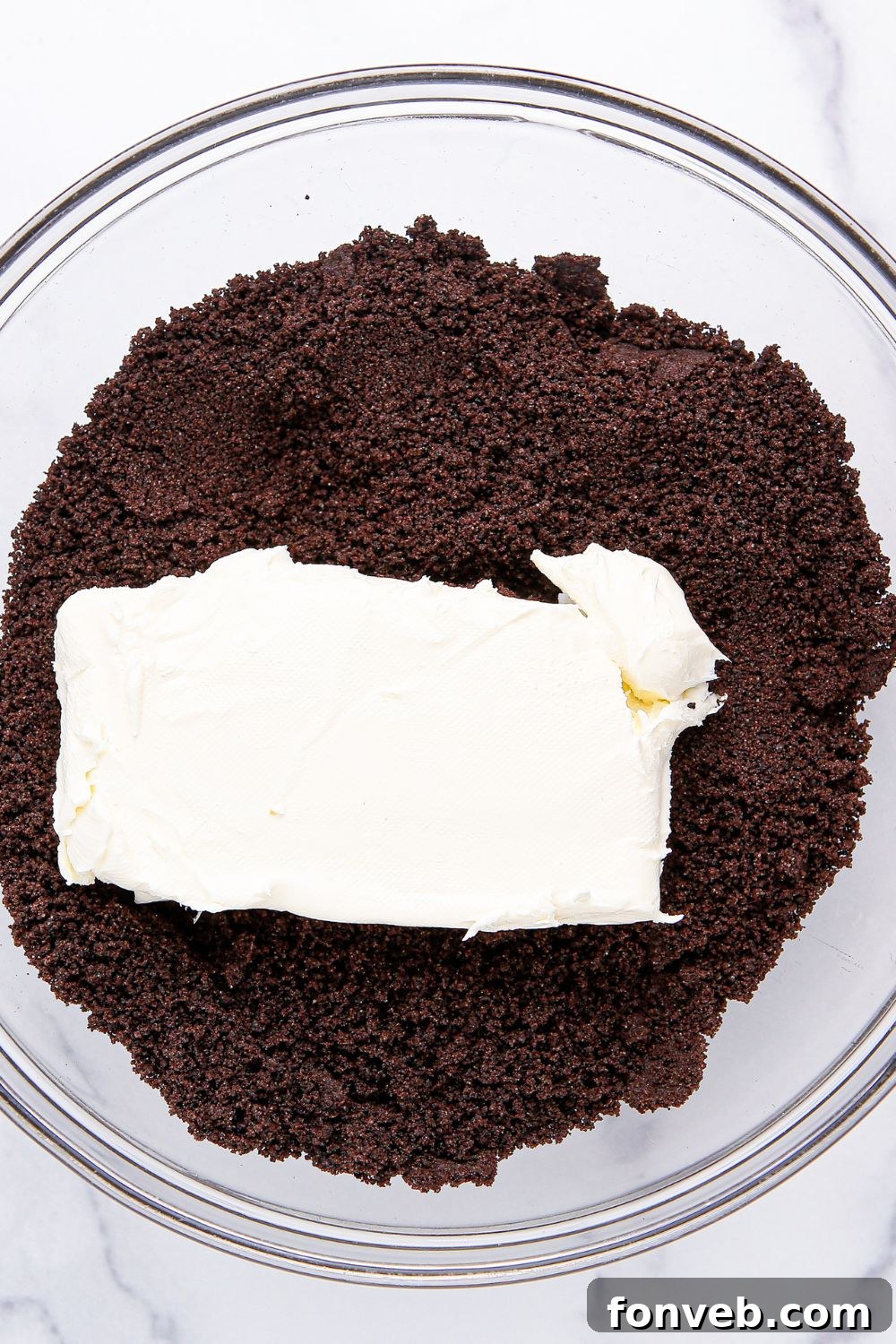 Pumpkin Spiced Oreo Truffles 7 cream cheese and crushed oreo in bowl