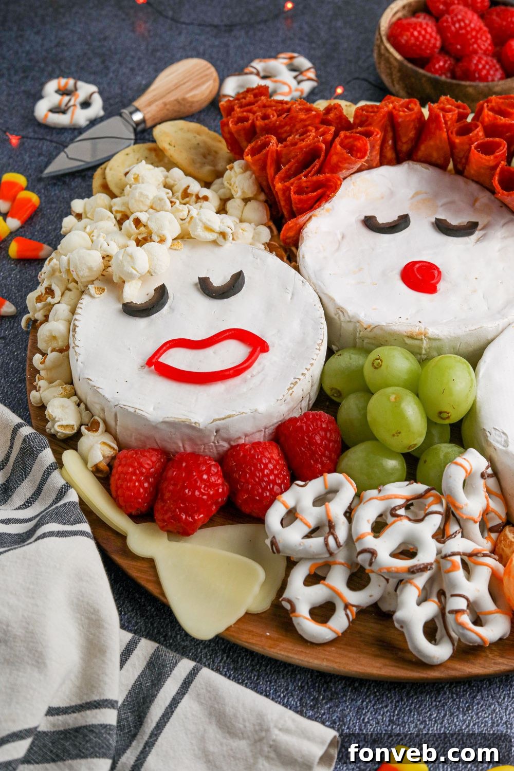 A Hocus Pocus themed snack board laid out on a table, showcasing the creative arrangement of ingredients and a festive Halloween ambiance.