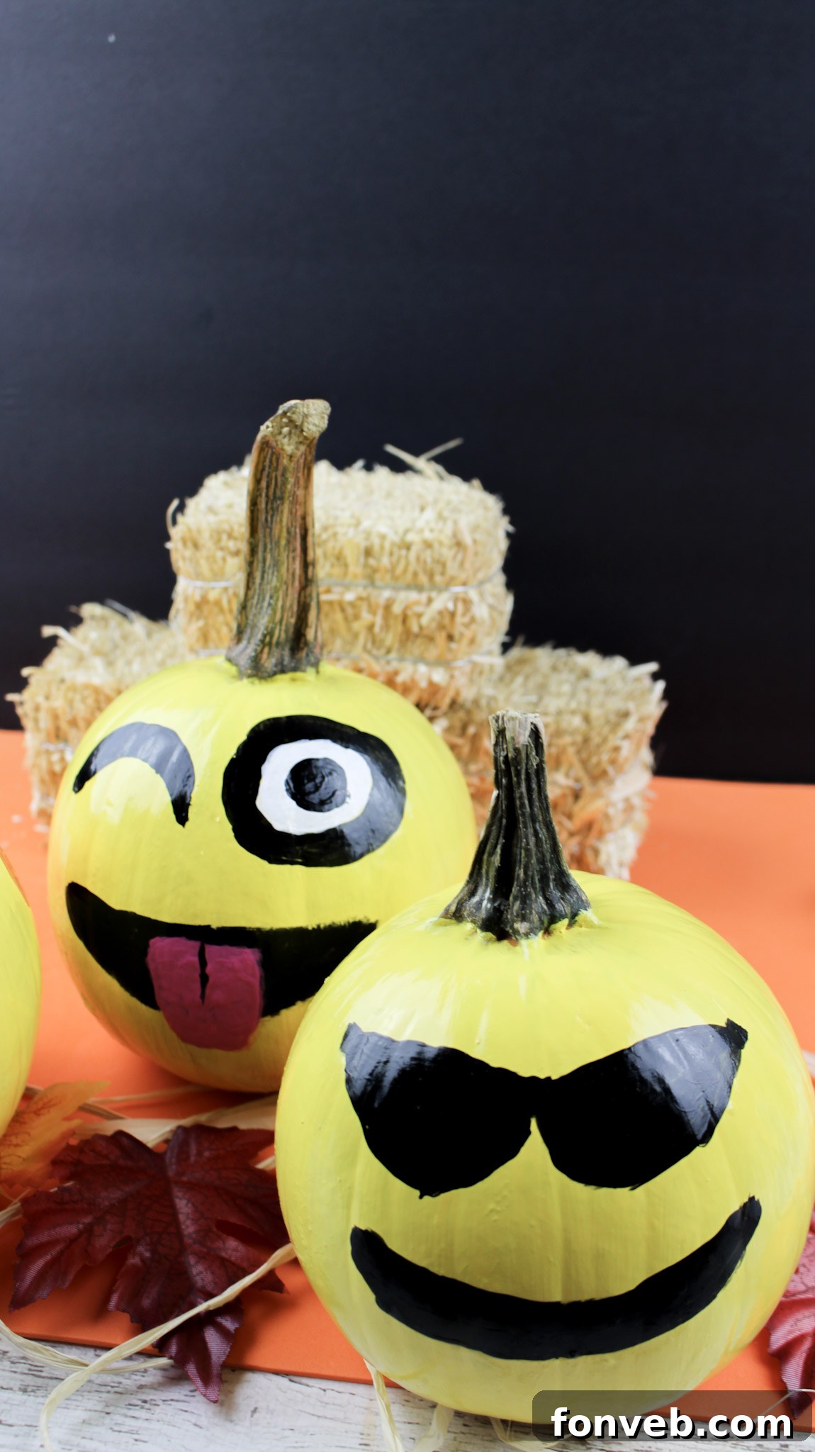 Pumpkins with Personality 14 Three finished emoji pumpkins displayed together, showcasing the variety of expressions and the success of the DIY project.