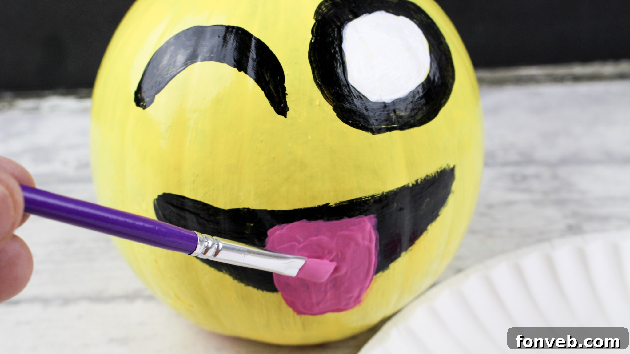 Pumpkins with Personality 10 A selection of colorful acrylic paints laid out on a paper plate palette, ready for the pumpkin decorating project.