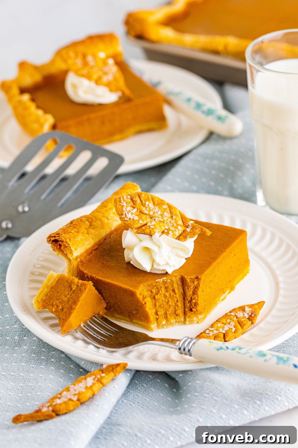 bite taken out of pie slice on plate