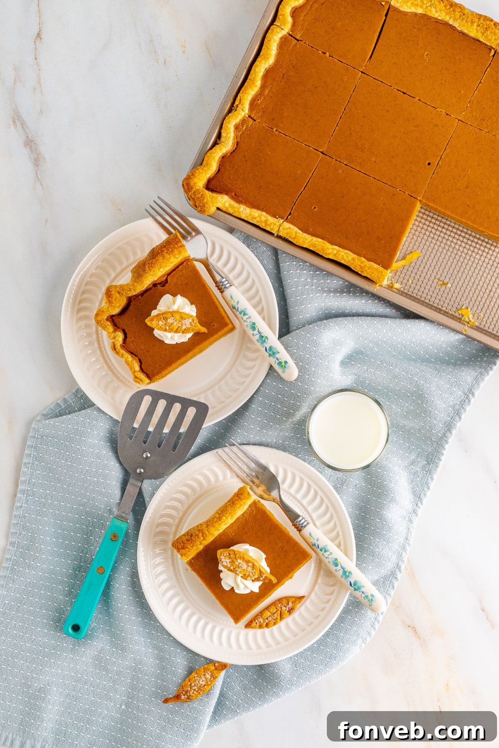 overhead shot of slab pumpkin pie in pan and a few slices on a plate