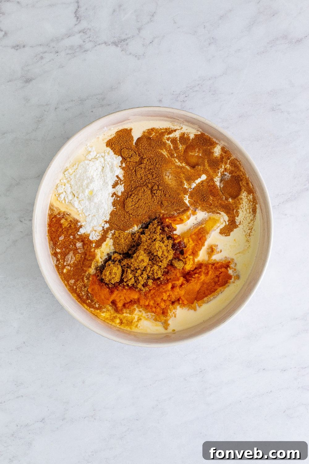 ingredients for pumpkin pie in a bowl