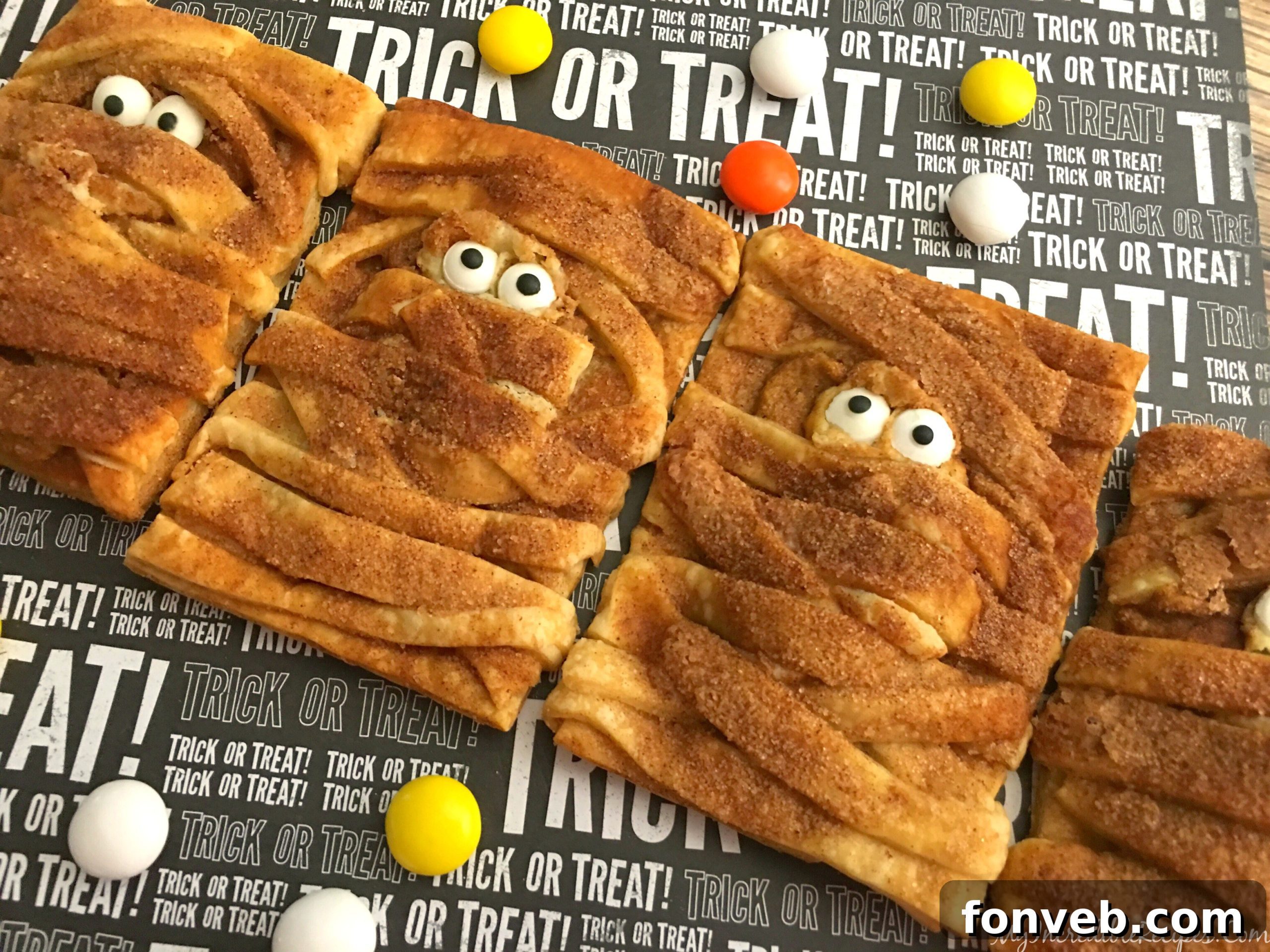 Ultra cute mummies ready for baking, showcasing the strips and candy eyes