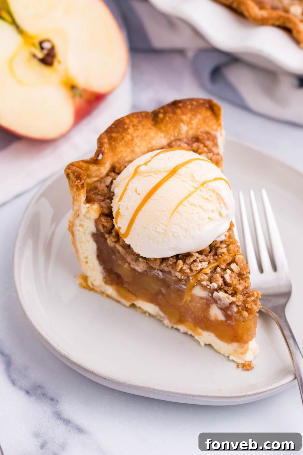 Spiced Apple Crumble Cheesecake Pie 15 caramel apple crumbl pie on plate