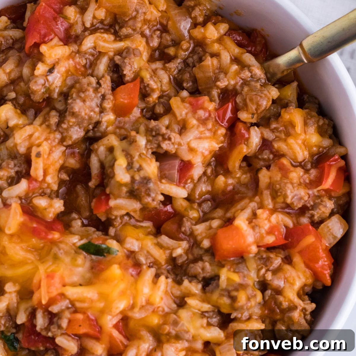 Stuffed Pepper Casserole in a bowl with fork on the side