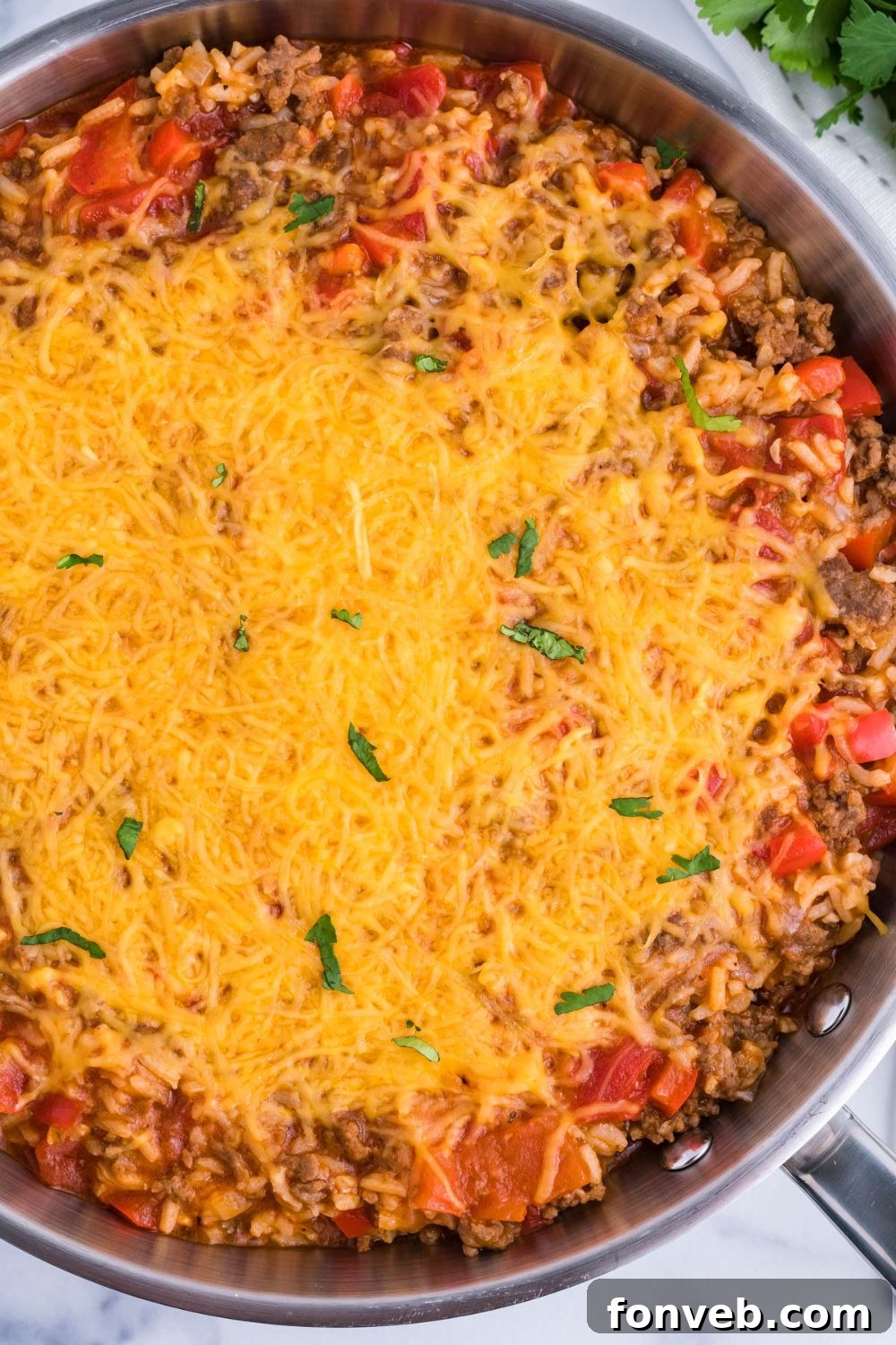 Stuffed Pepper Casserole in pan with cheese on top 