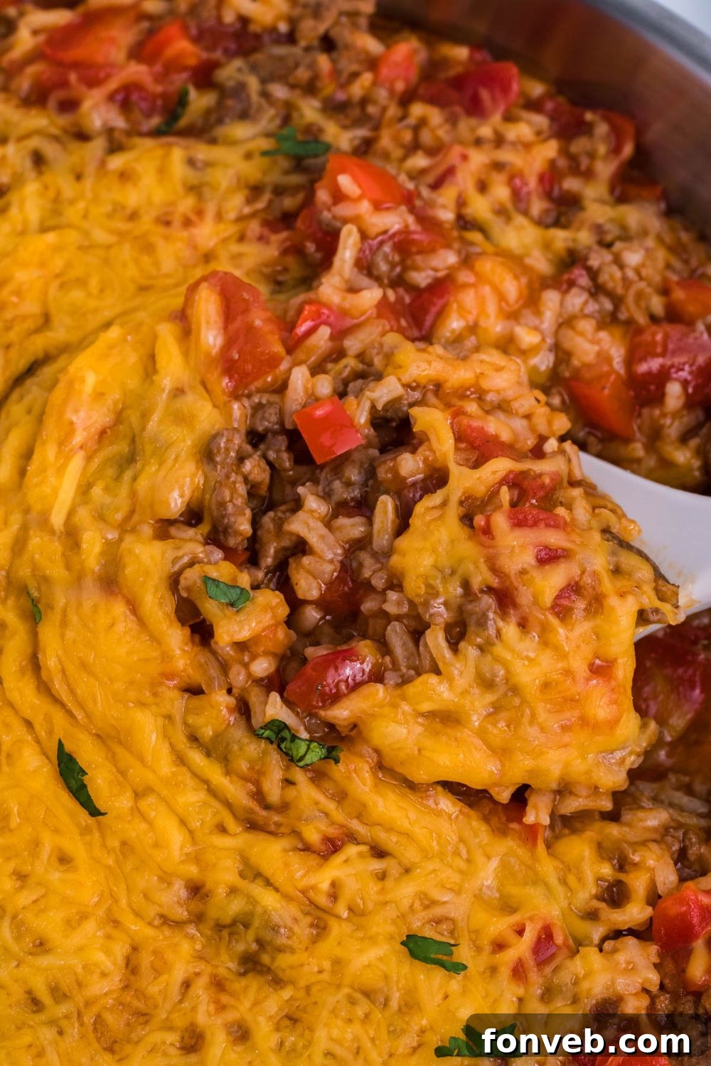 Stuffed Pepper Casserole in pan with a spoon scooping some up 
