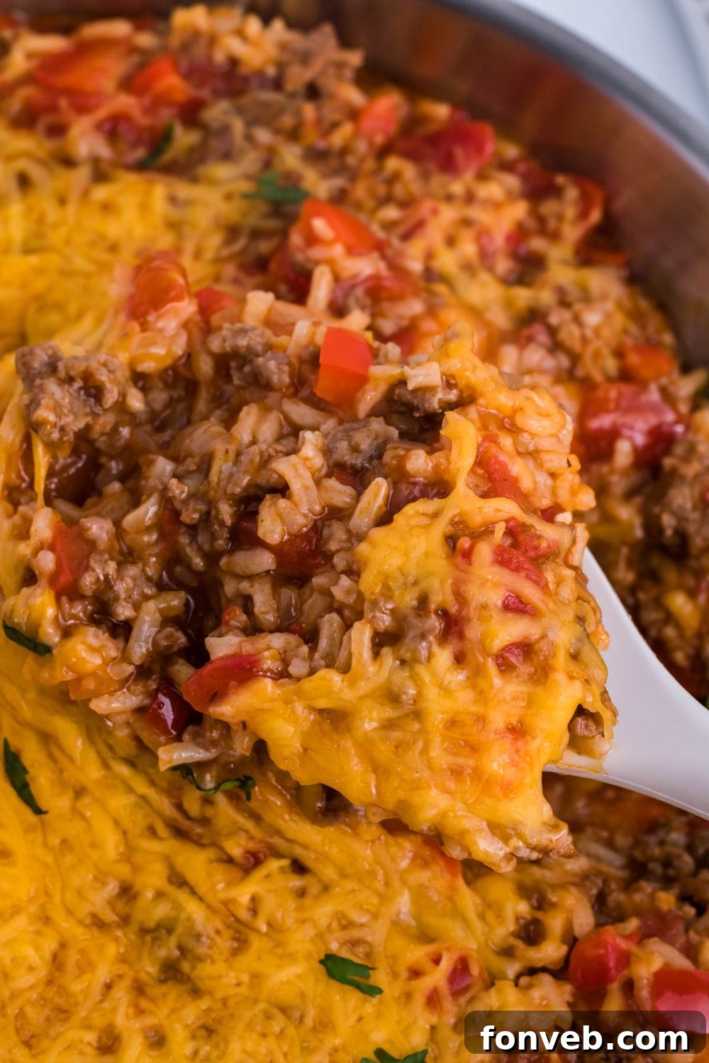 Stuffed Pepper Casserole with a spoon in it in pan