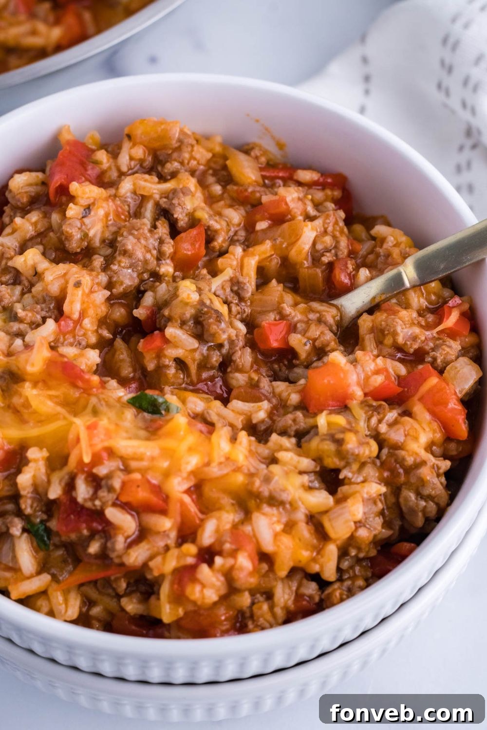 bowl with a spoon in it with pepper casserole 