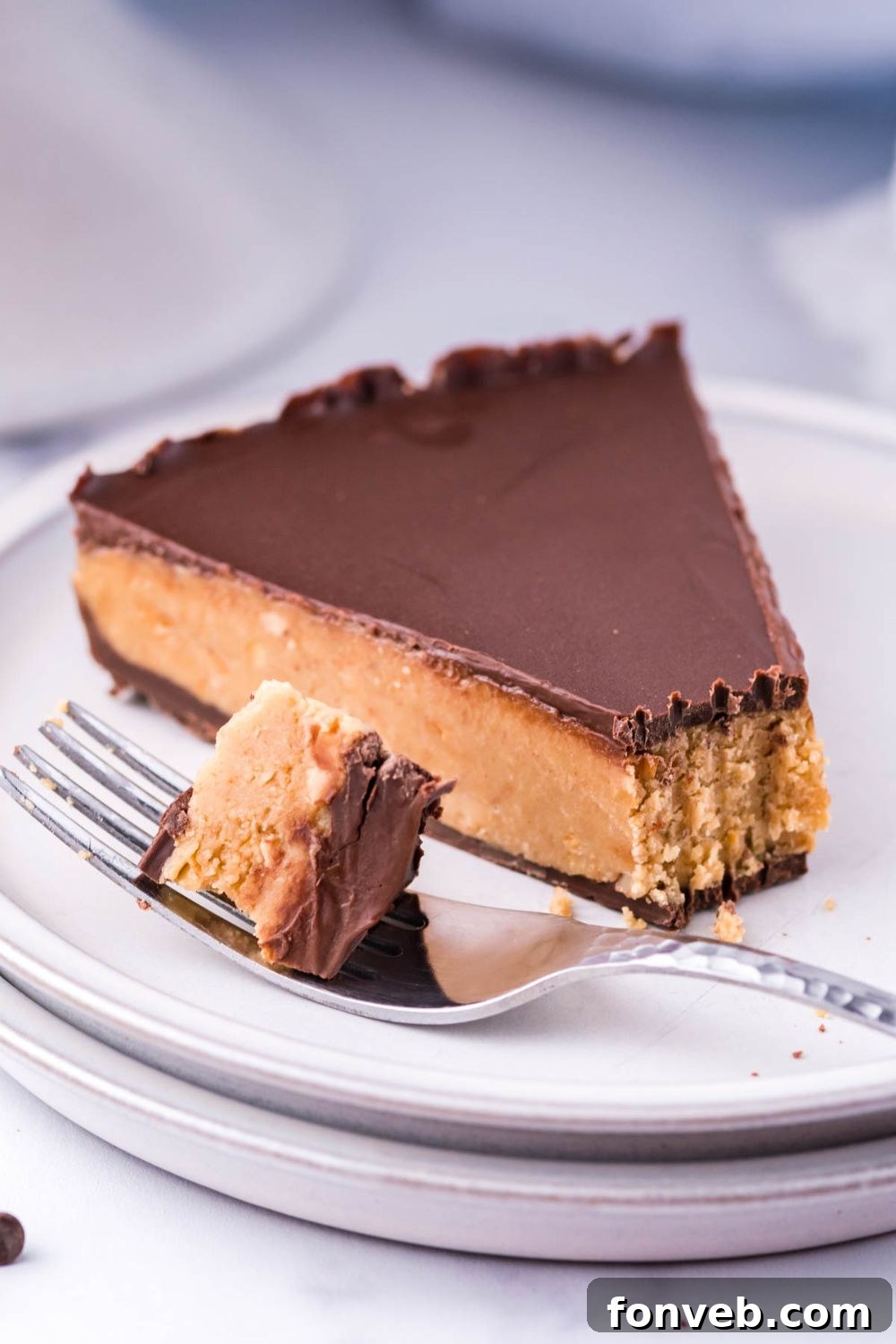 slice of Reese's pie on plate with a bite on fork