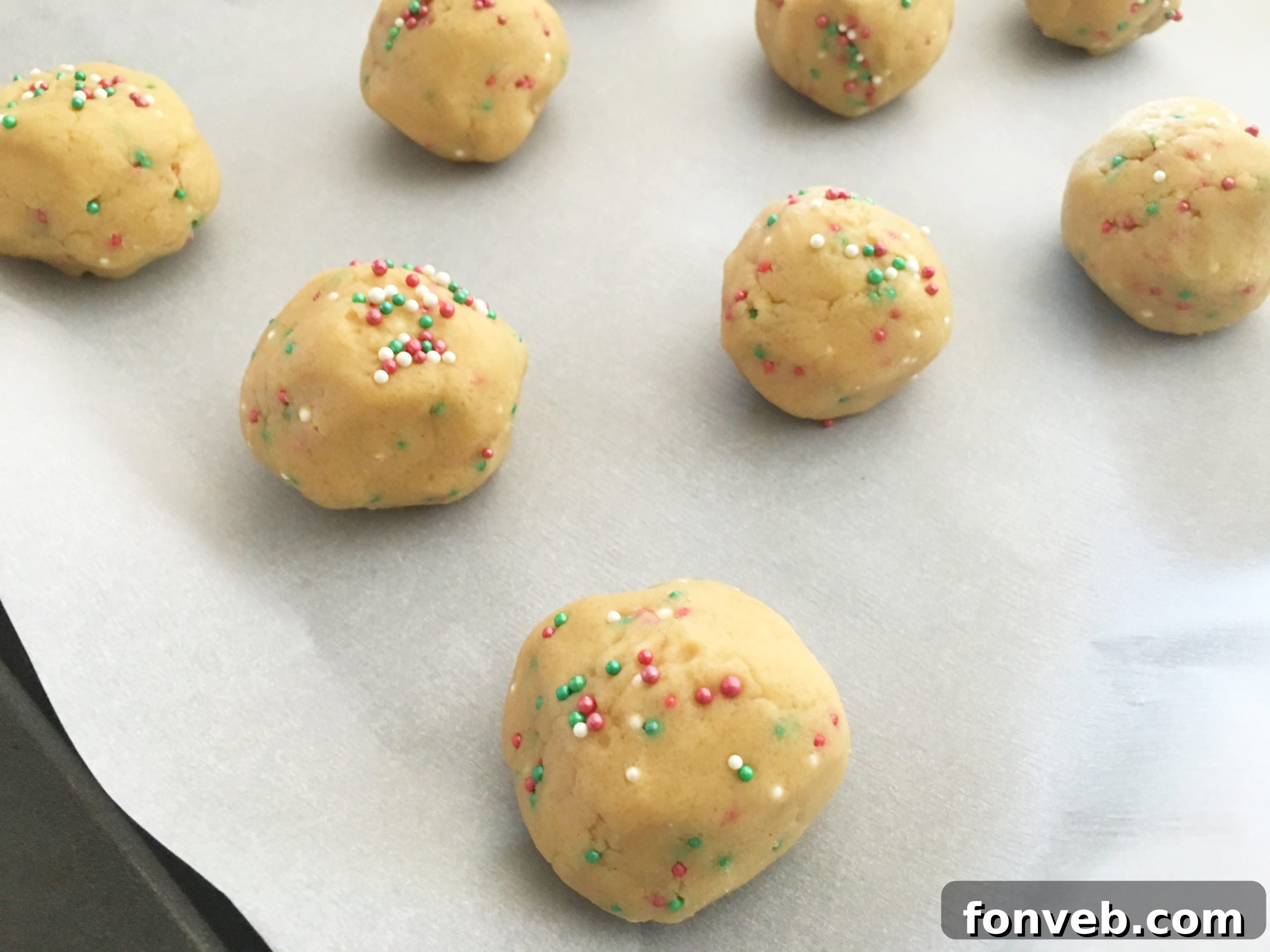 Freshly baked peanut butter blossoms cooling